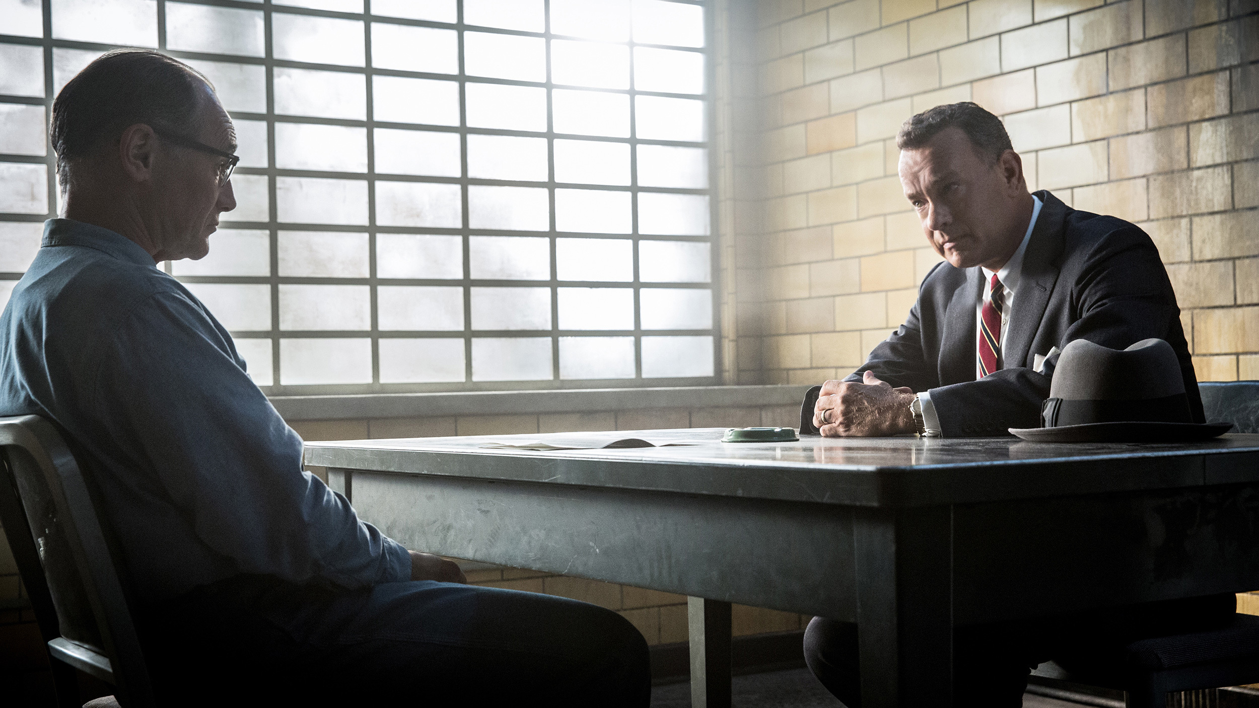 Tom Hanks in a prison interrogation room HD Wallpaper