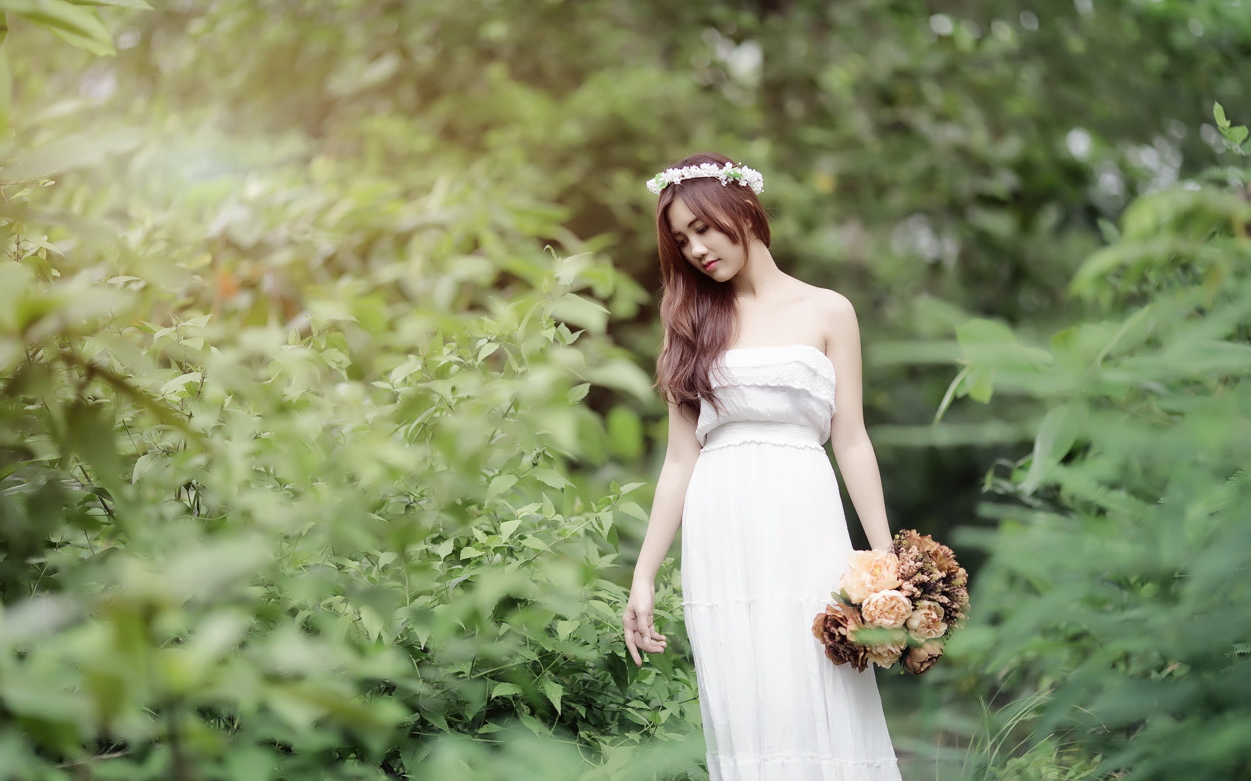 Woman in white dress with flower crown holding bouquet HD Wallpaper