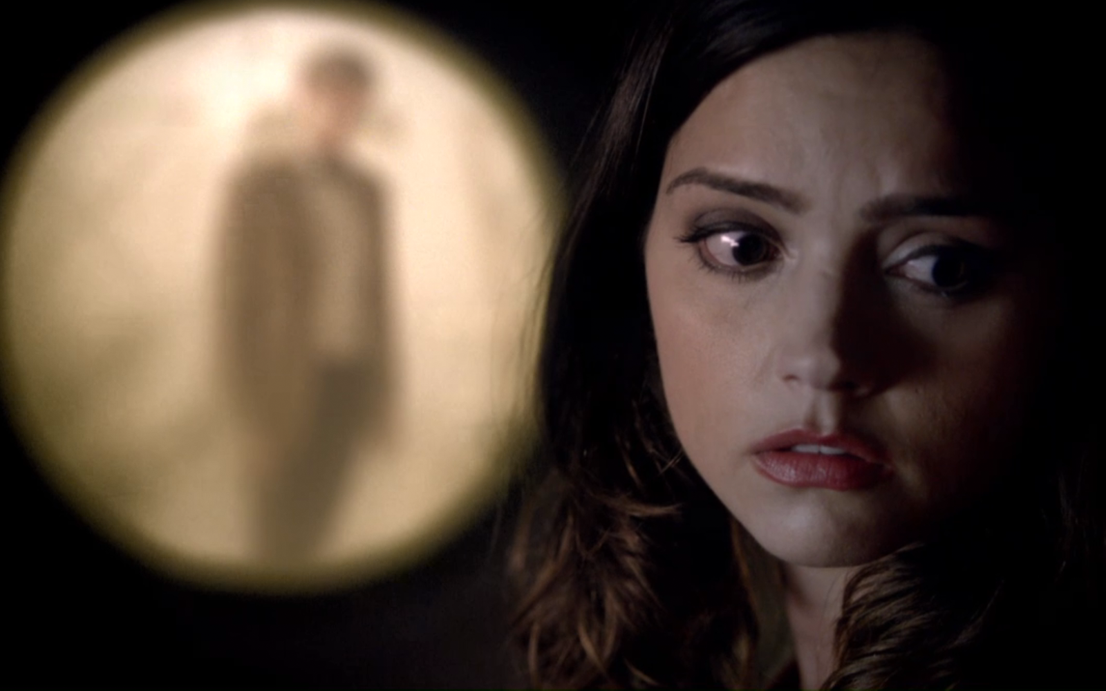 Jenna Coleman in a dimly lit scene HD Wallpaper