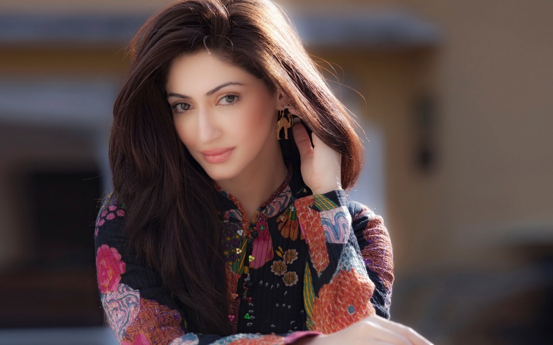 Woman with dark hair and patterned shirt HD Wallpaper