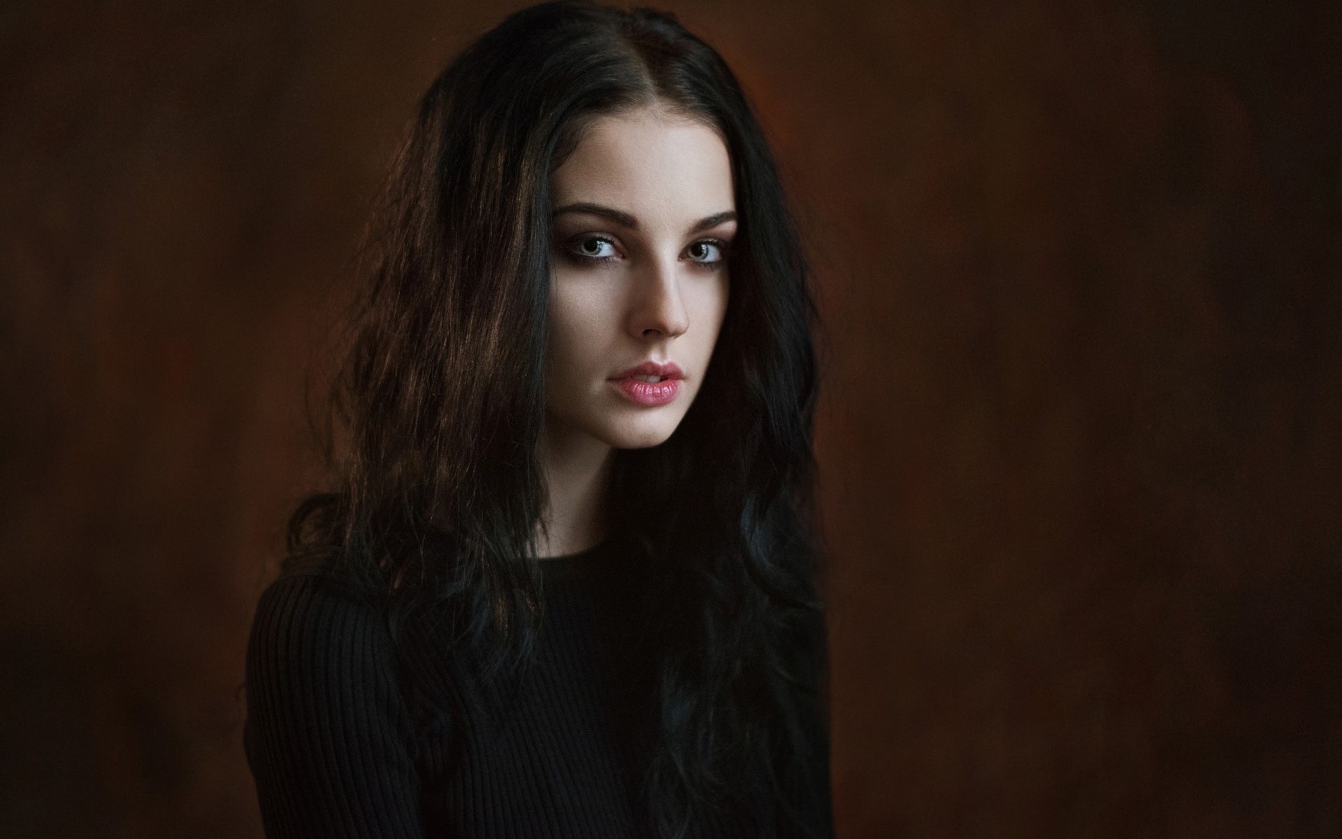 Woman with dark hair and black top HD Wallpaper