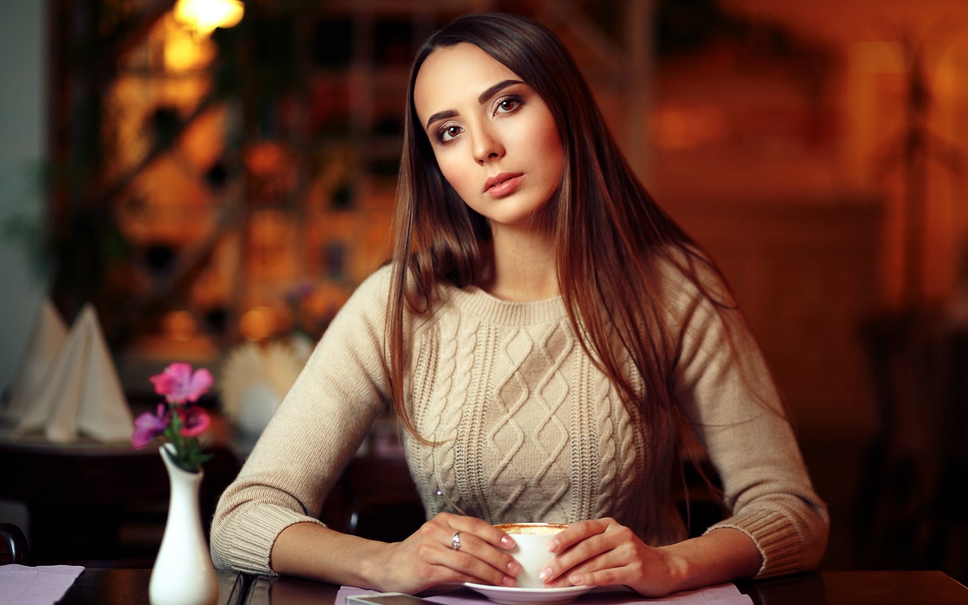 Woman in sweater holding a cup of coffee HD Wallpaper