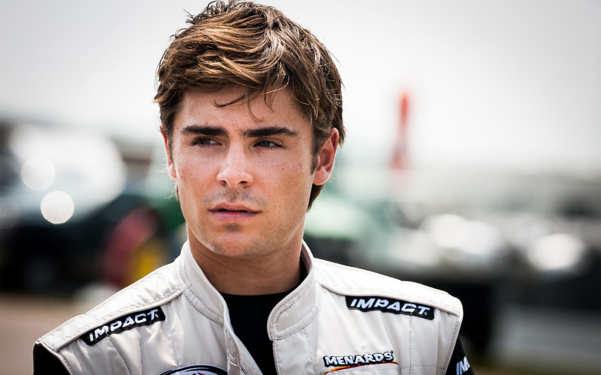 Zac Efron in Racing Suit HD Wallpaper