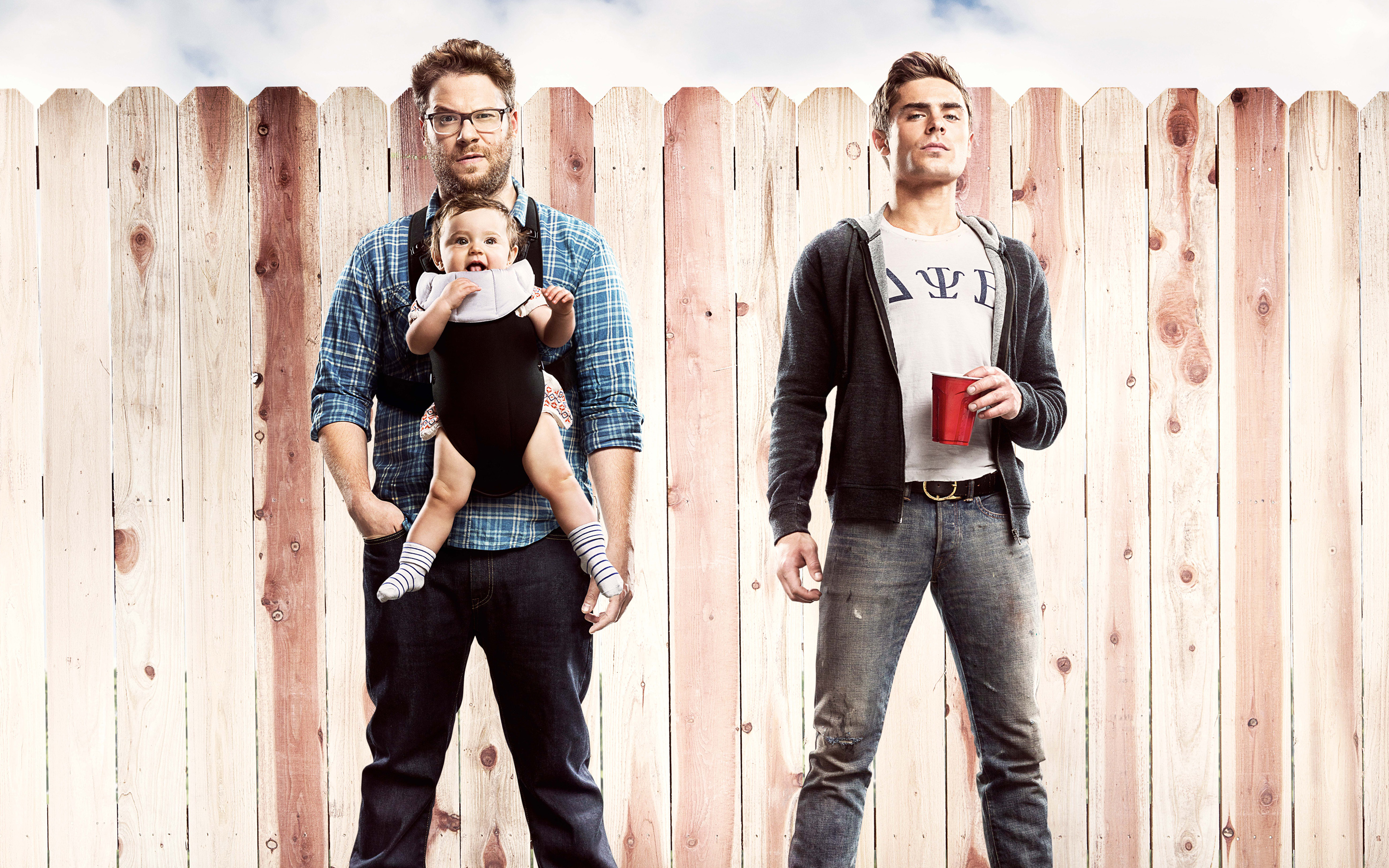 Seth Rogen and Zac Efron with a baby HD Wallpaper