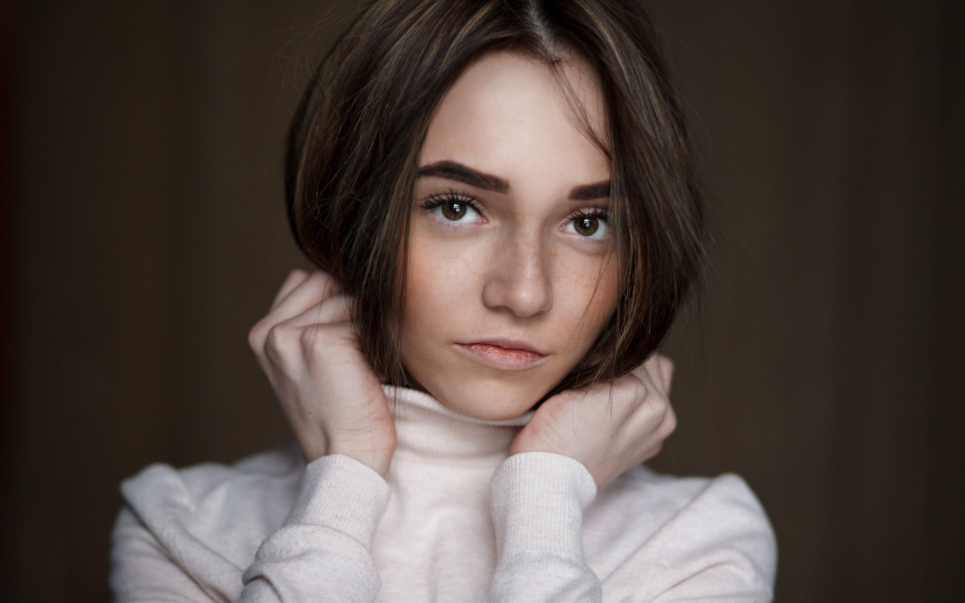 Young woman with brown hair wearing a turtleneck HD Wallpaper