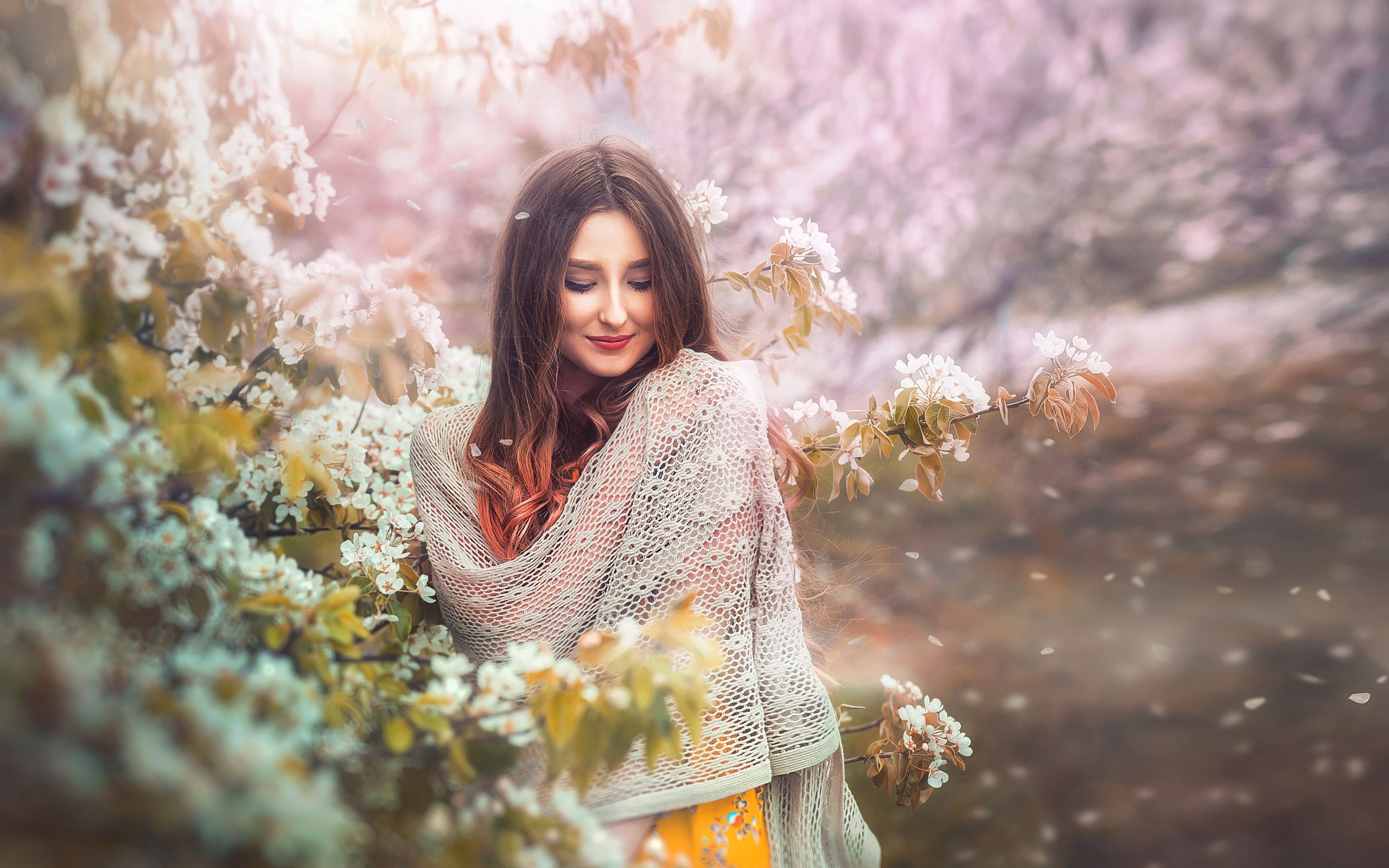 Woman in a shawl surrounded by blooming trees HD Wallpaper