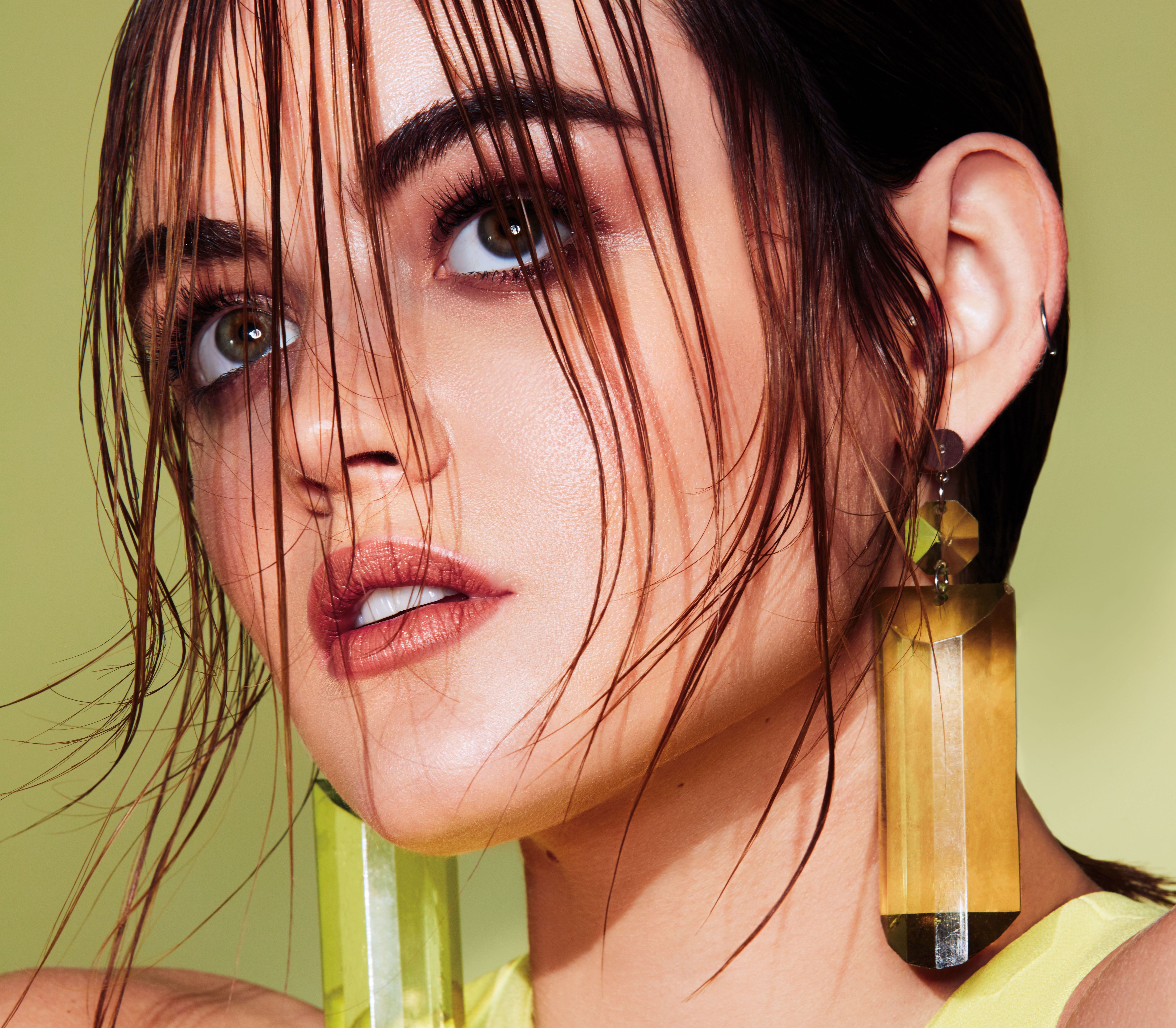 Lucy Hale with wet hair and large earrings HD Wallpaper