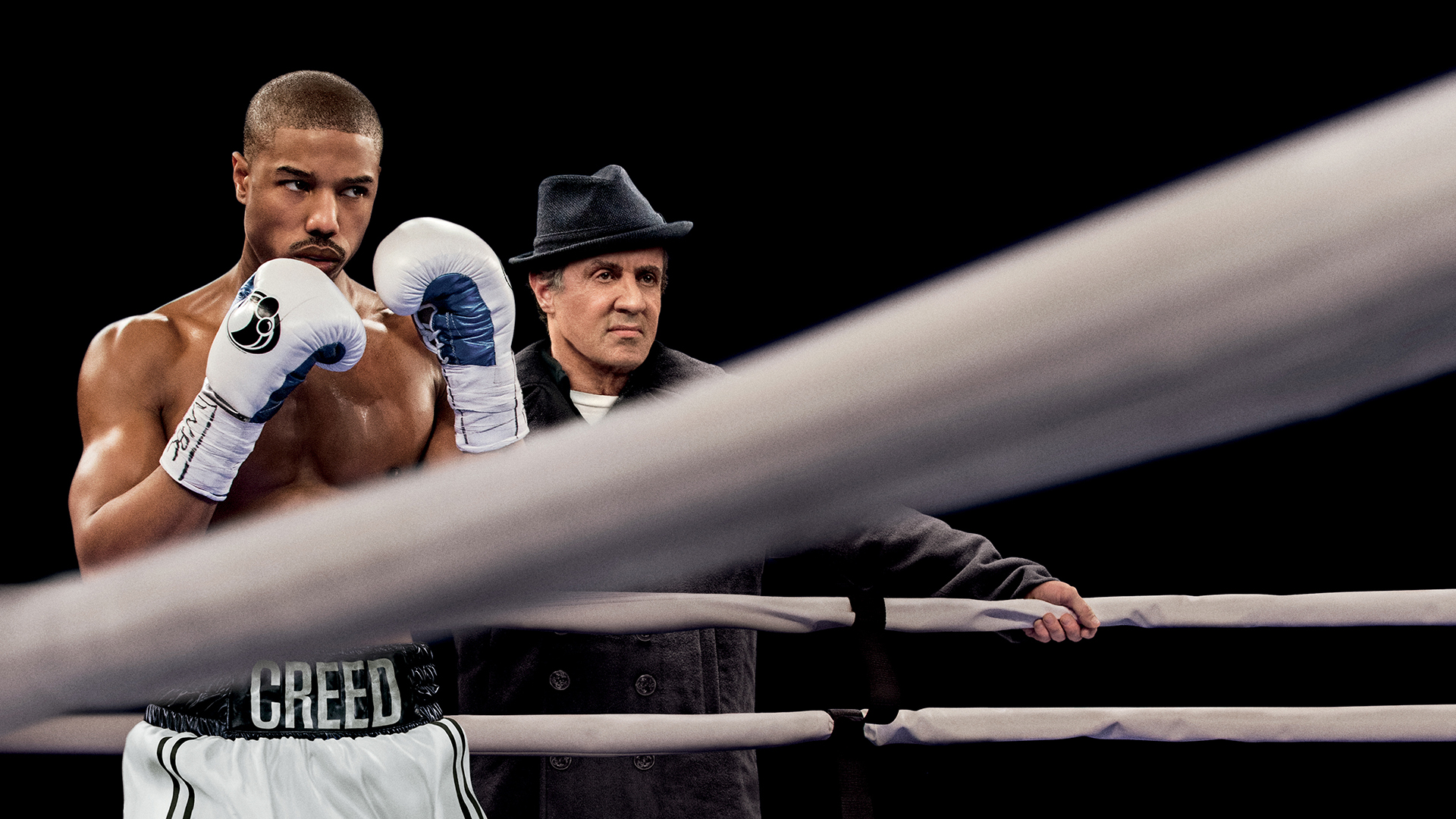 Adonis Creed and Rocky Balboa in a boxing ring HD Wallpaper