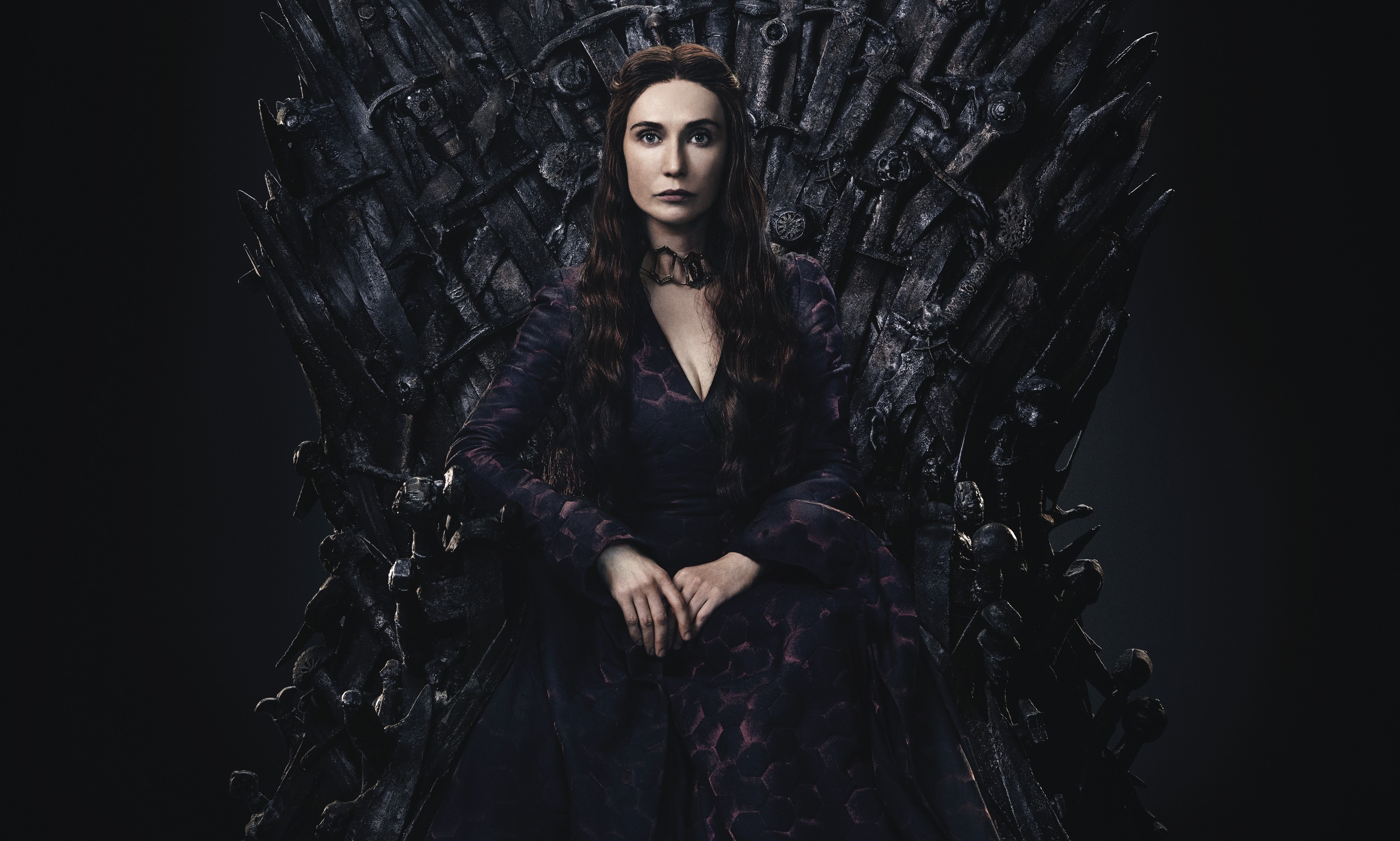 Melisandre from Game of Thrones sitting on the Iron Throne HD Wallpaper