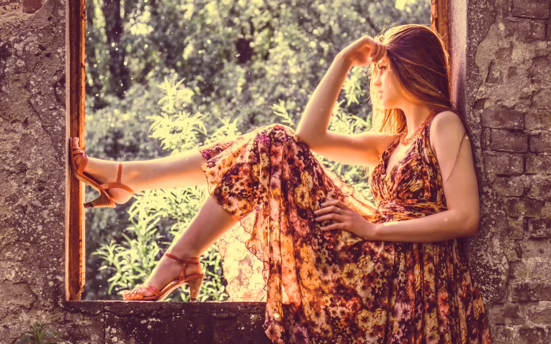 Woman in floral dress sitting in a window frame HD Wallpaper
