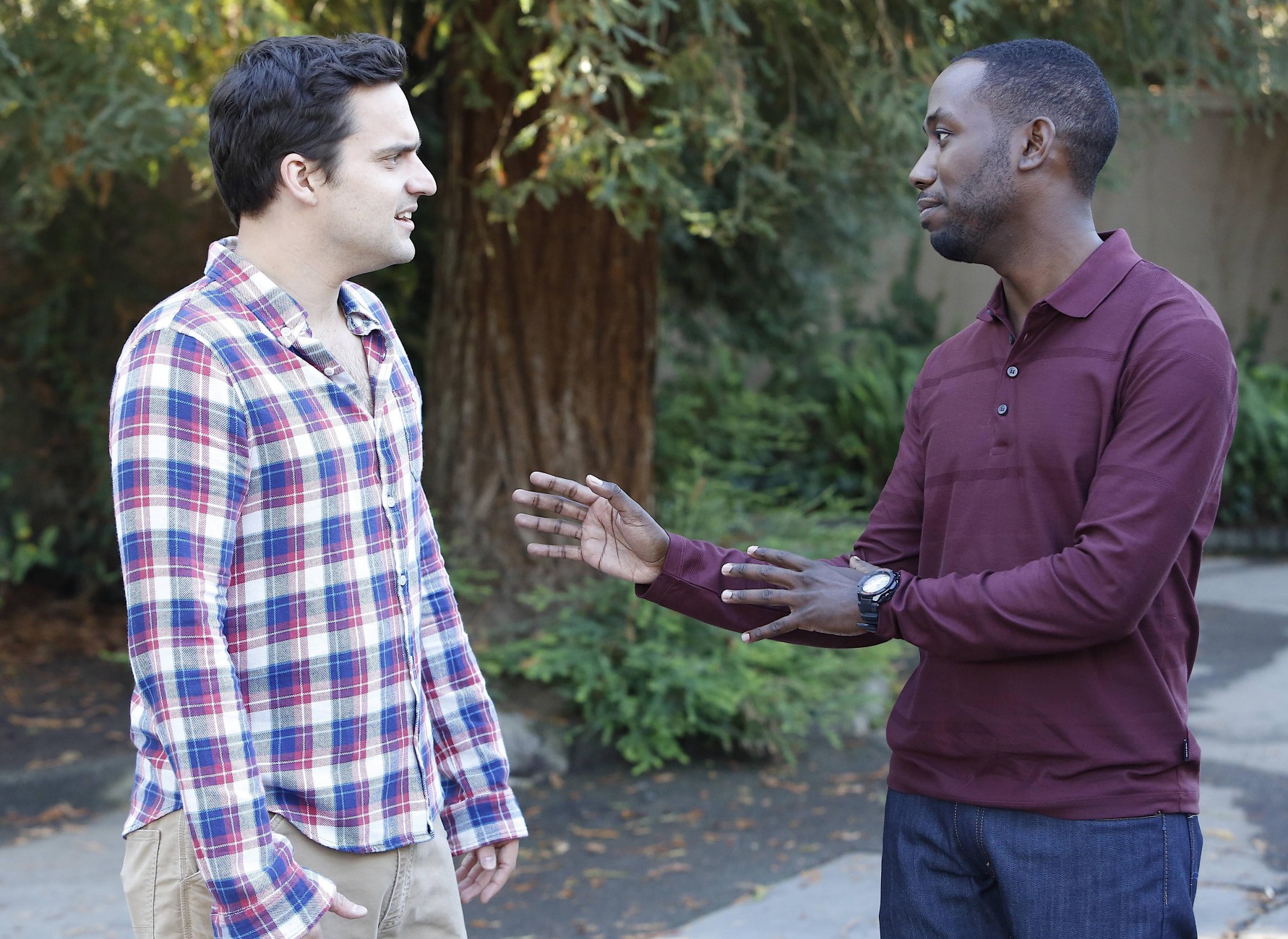Lamorne Morris and Nick Kroll talking outdoors HD Wallpaper