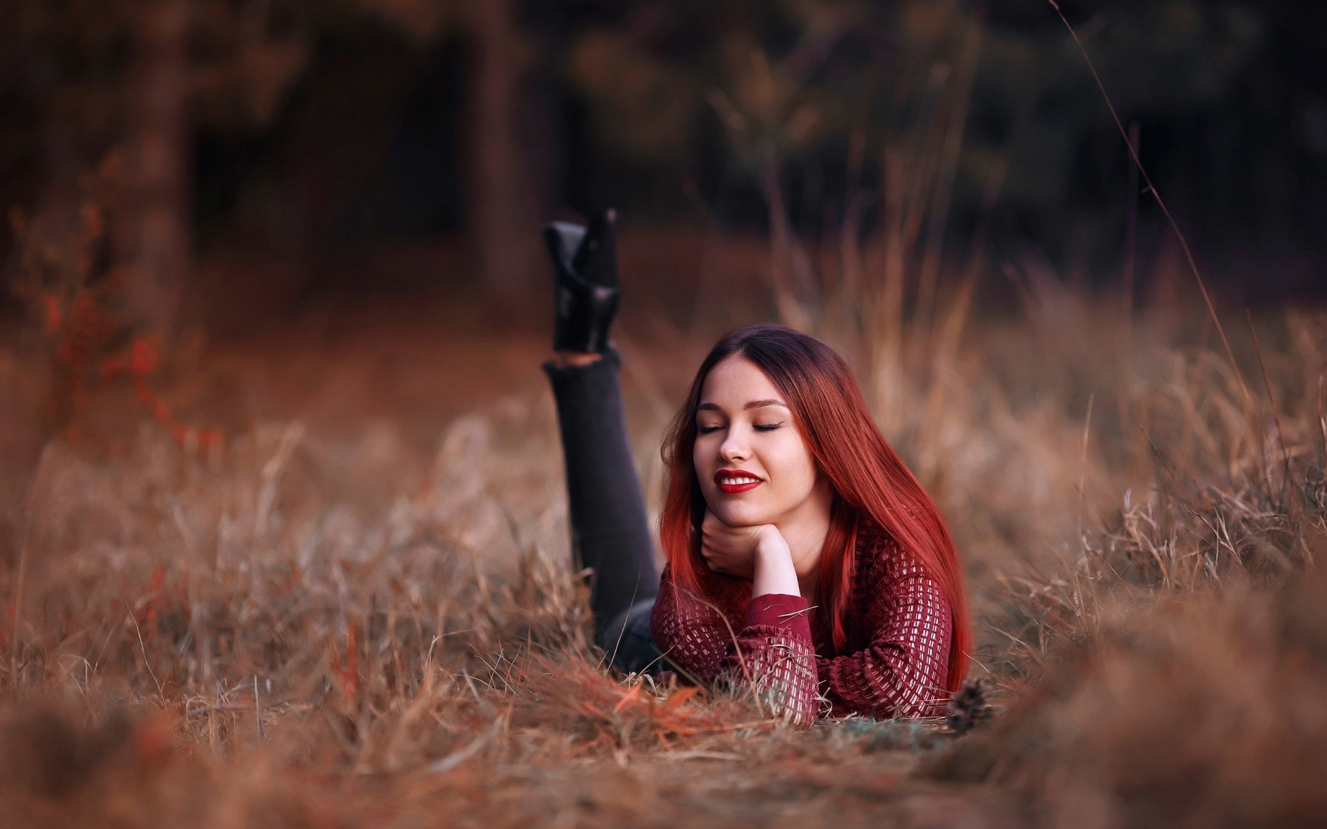 Woman with red hair lying in grass HD Wallpaper