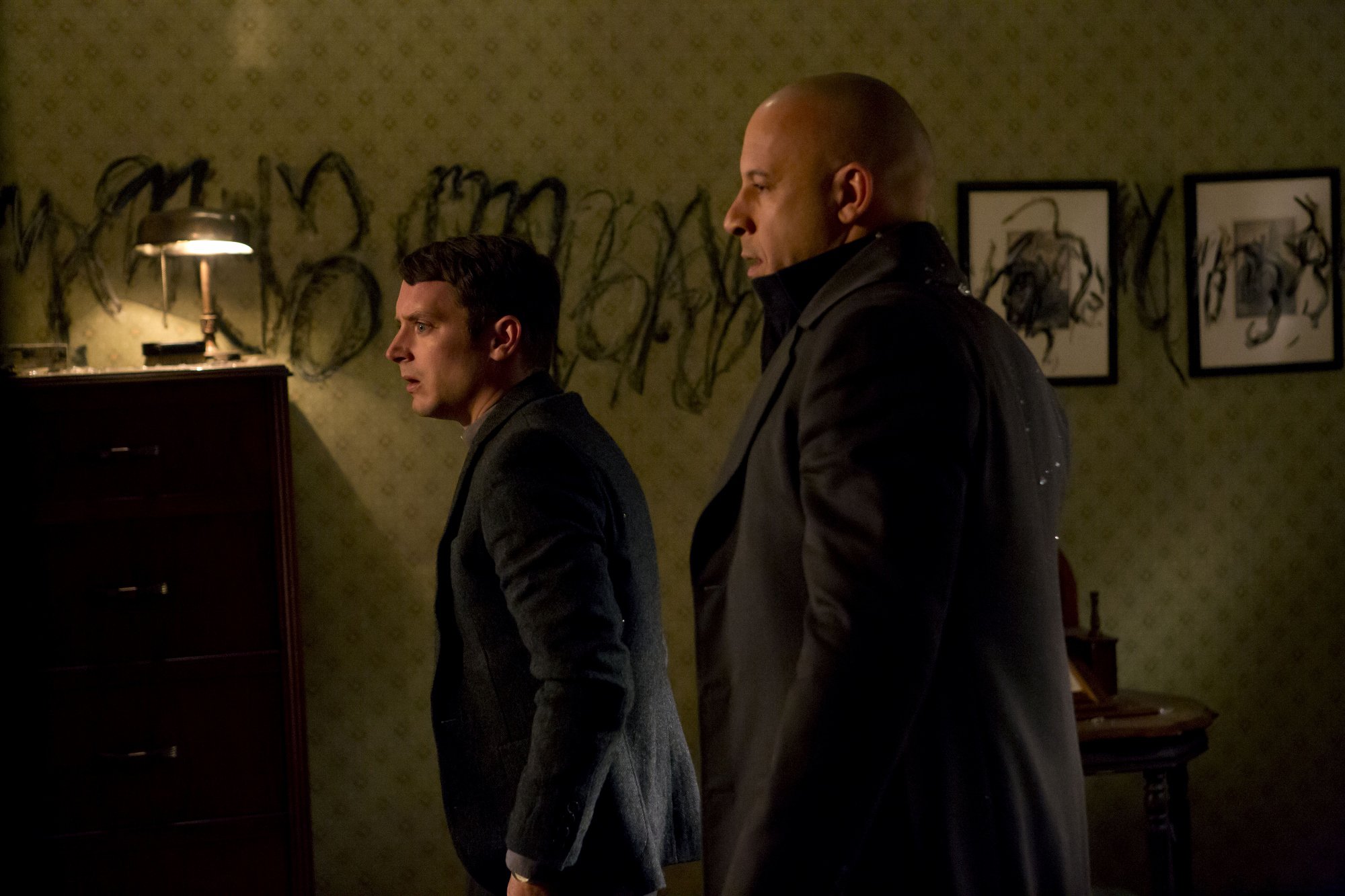 Elijah Wood and Vin Diesel in a dark room HD Wallpaper