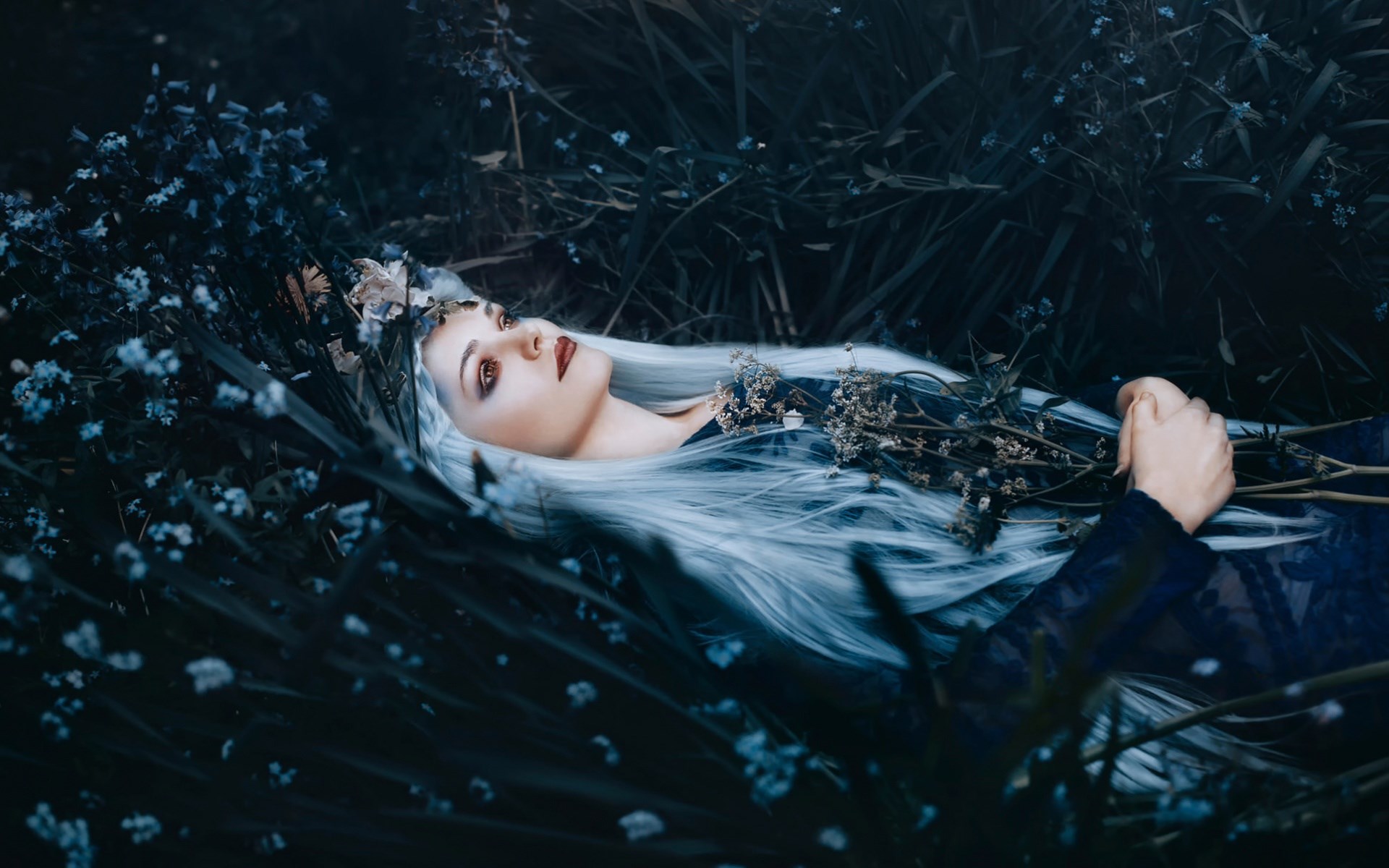 Woman with white hair lying in dark flowers HD Wallpaper