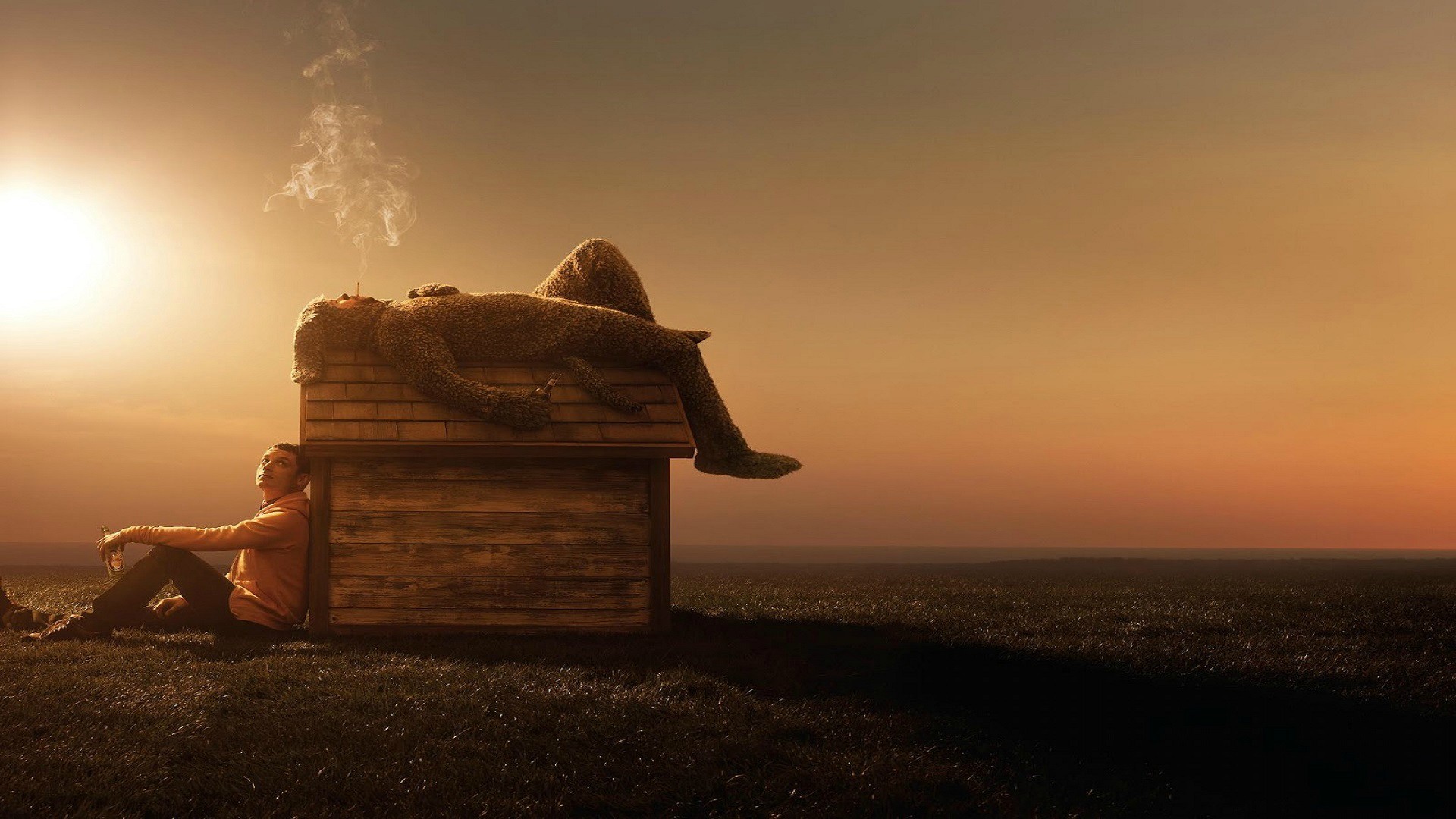 Elijah Wood sitting by a dog house with a teddy bear HD Wallpaper