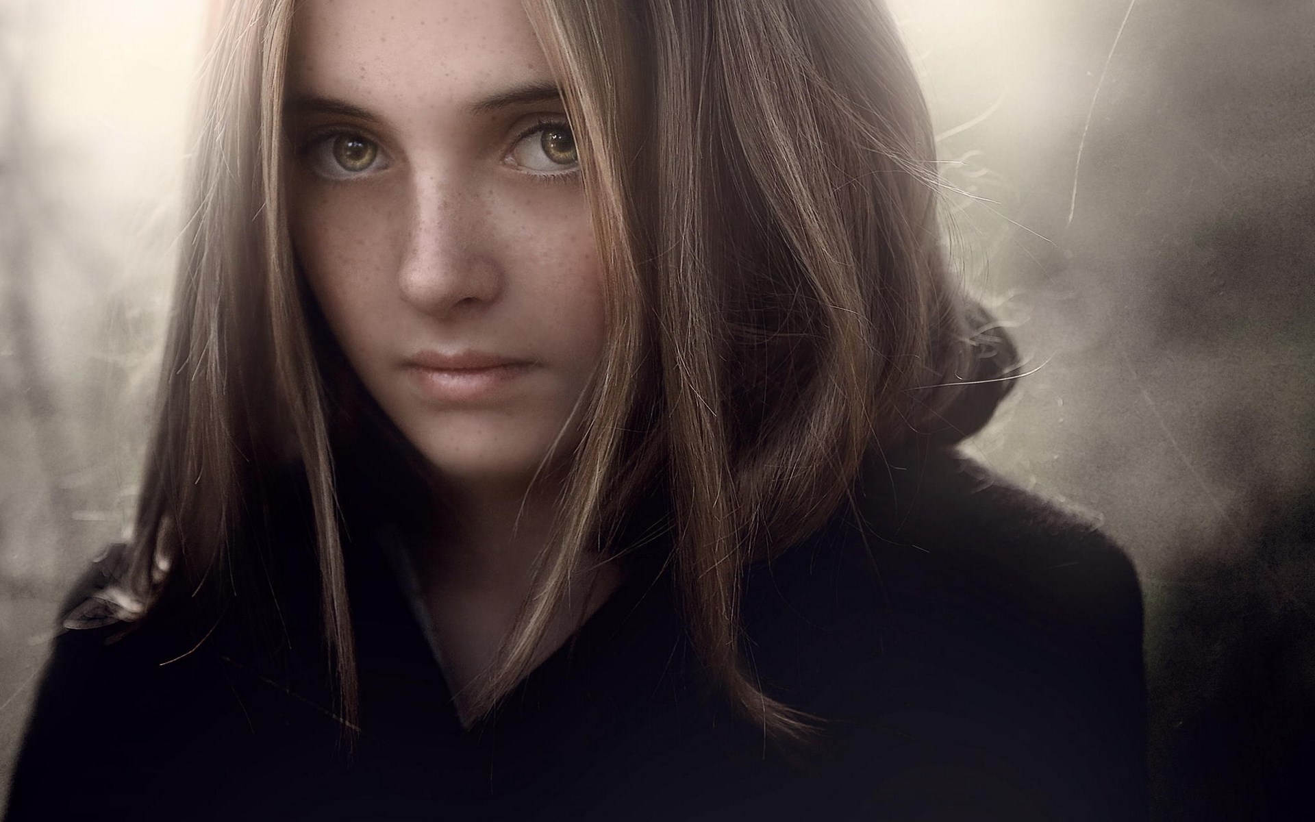 Young girl with freckles looking at the camera HD Wallpaper