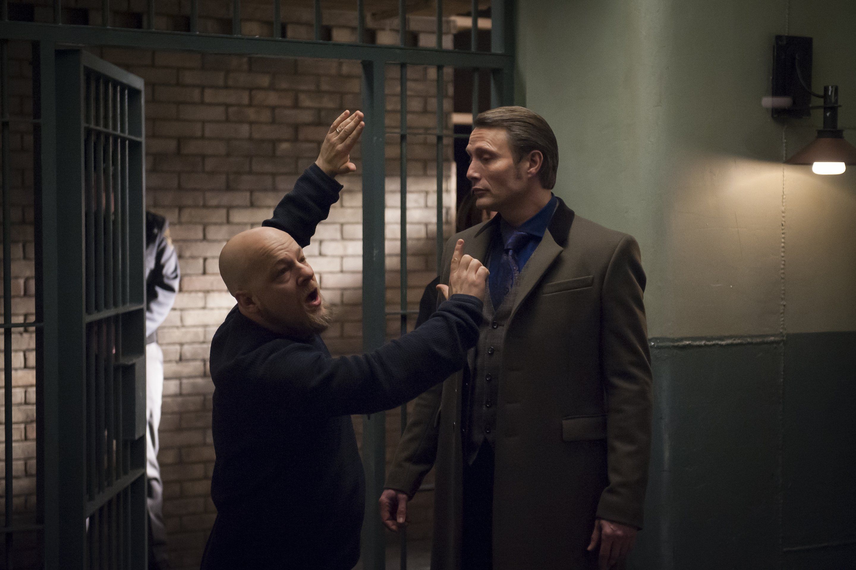 Mads Mikkelsen in a prison setting HD Wallpaper