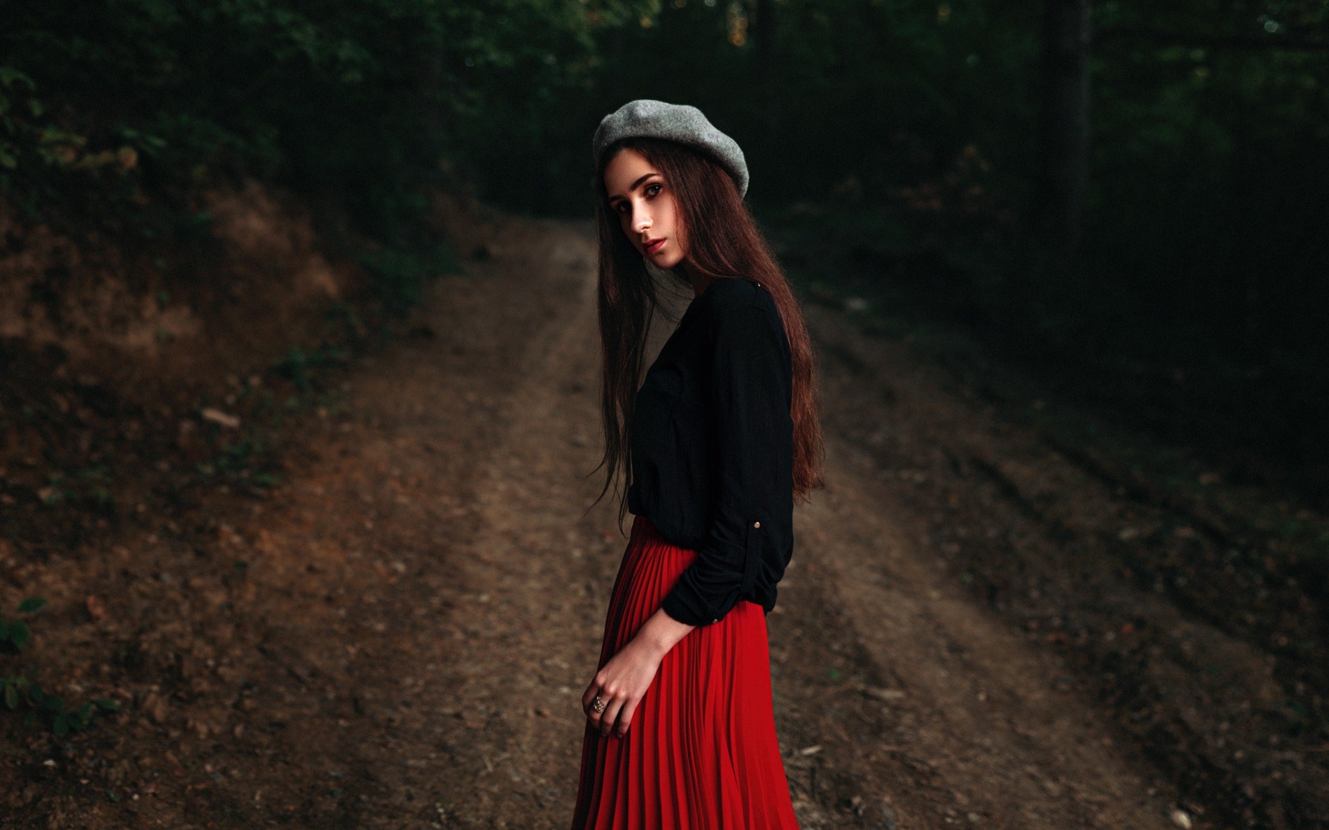 Woman in red skirt and beret in forest HD Wallpaper