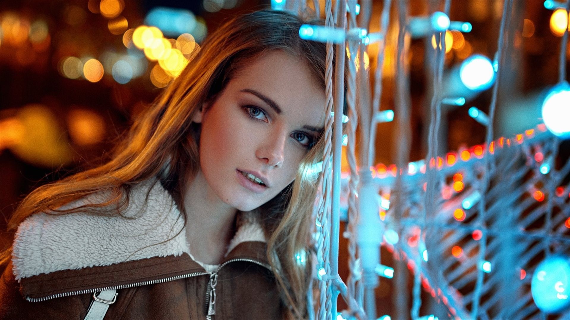 Woman with blue and orange lights HD Wallpaper