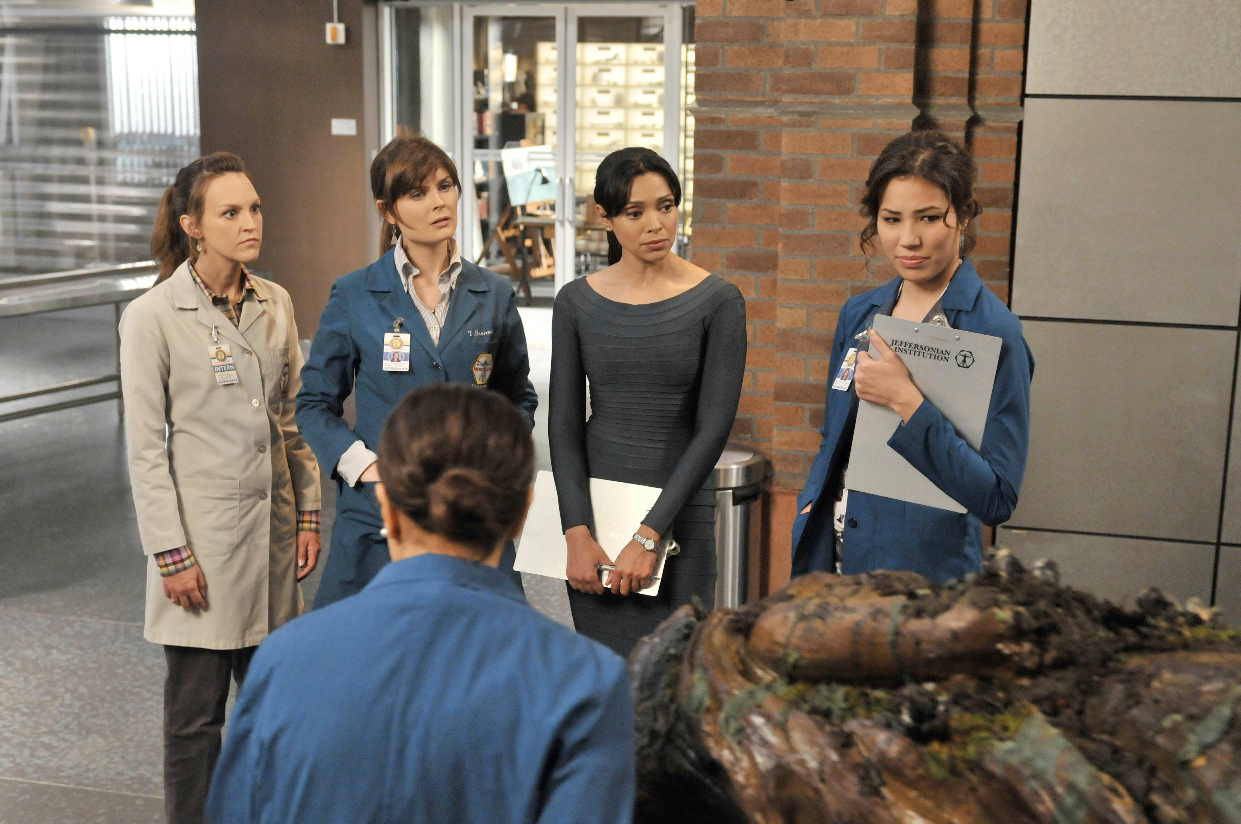 Four women in lab coats in a laboratory HD Wallpaper