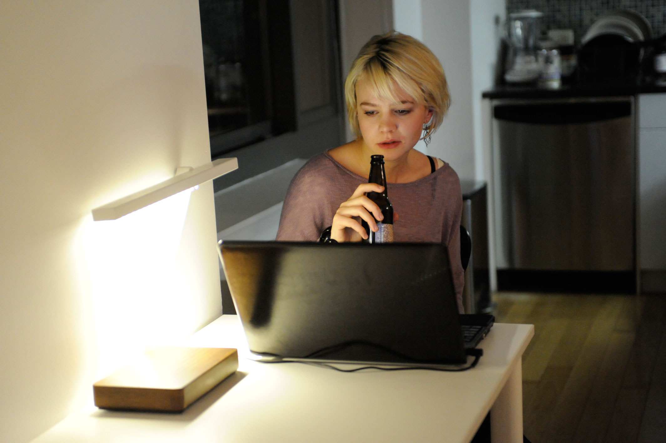 Carey Mulligan drinking beer and using laptop HD Wallpaper