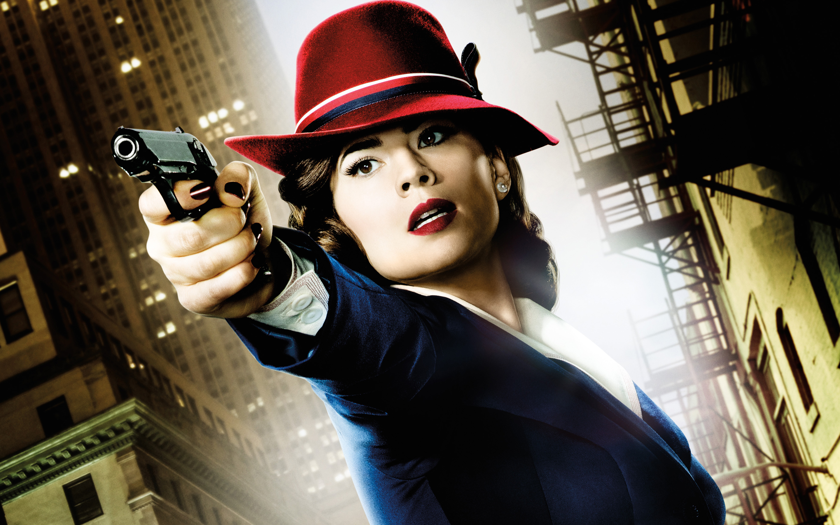 Hayley Atwell as Peggy Carter holding a gun HD Wallpaper