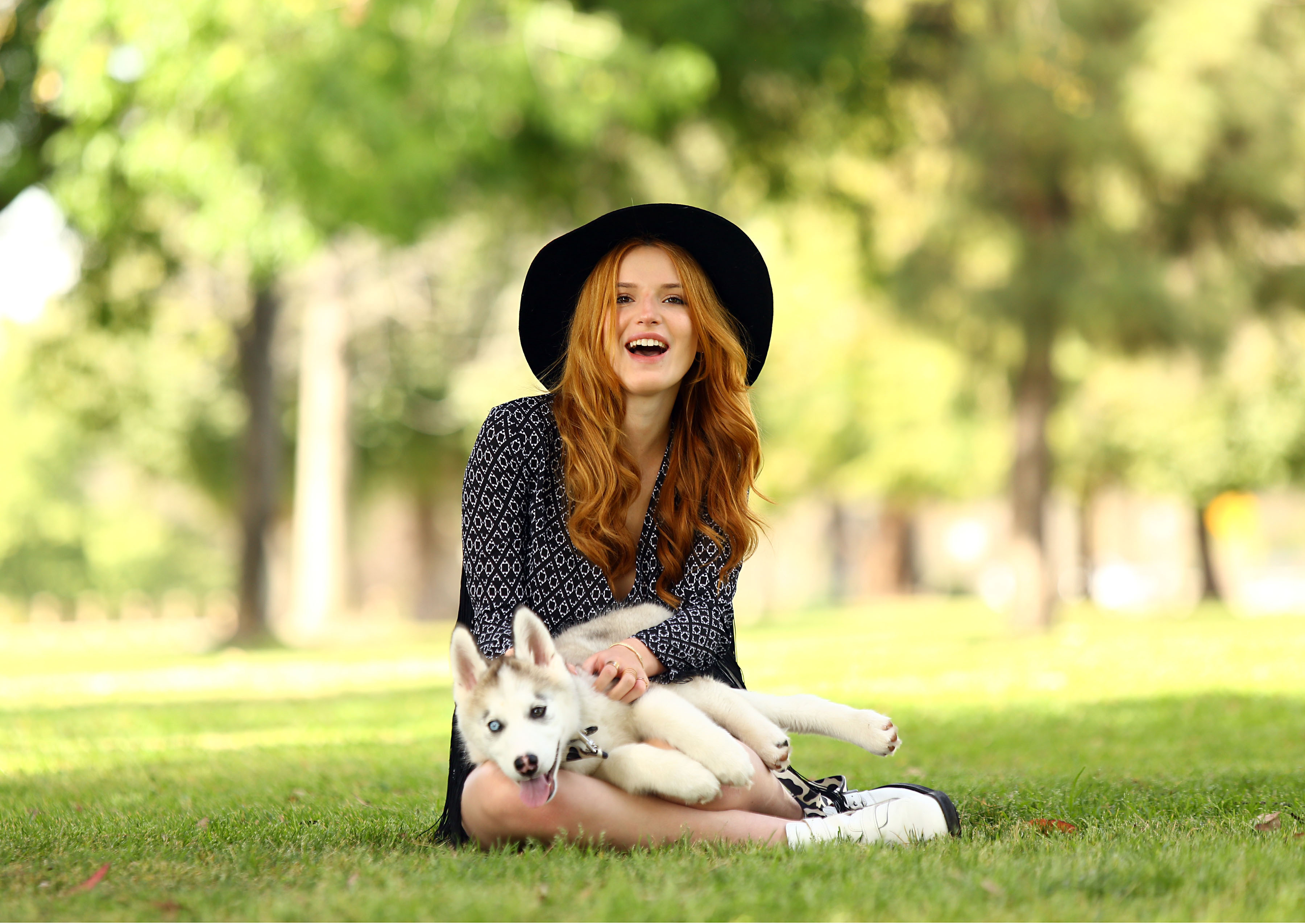 Bella Thorne with Husky Puppy in Park HD Wallpaper