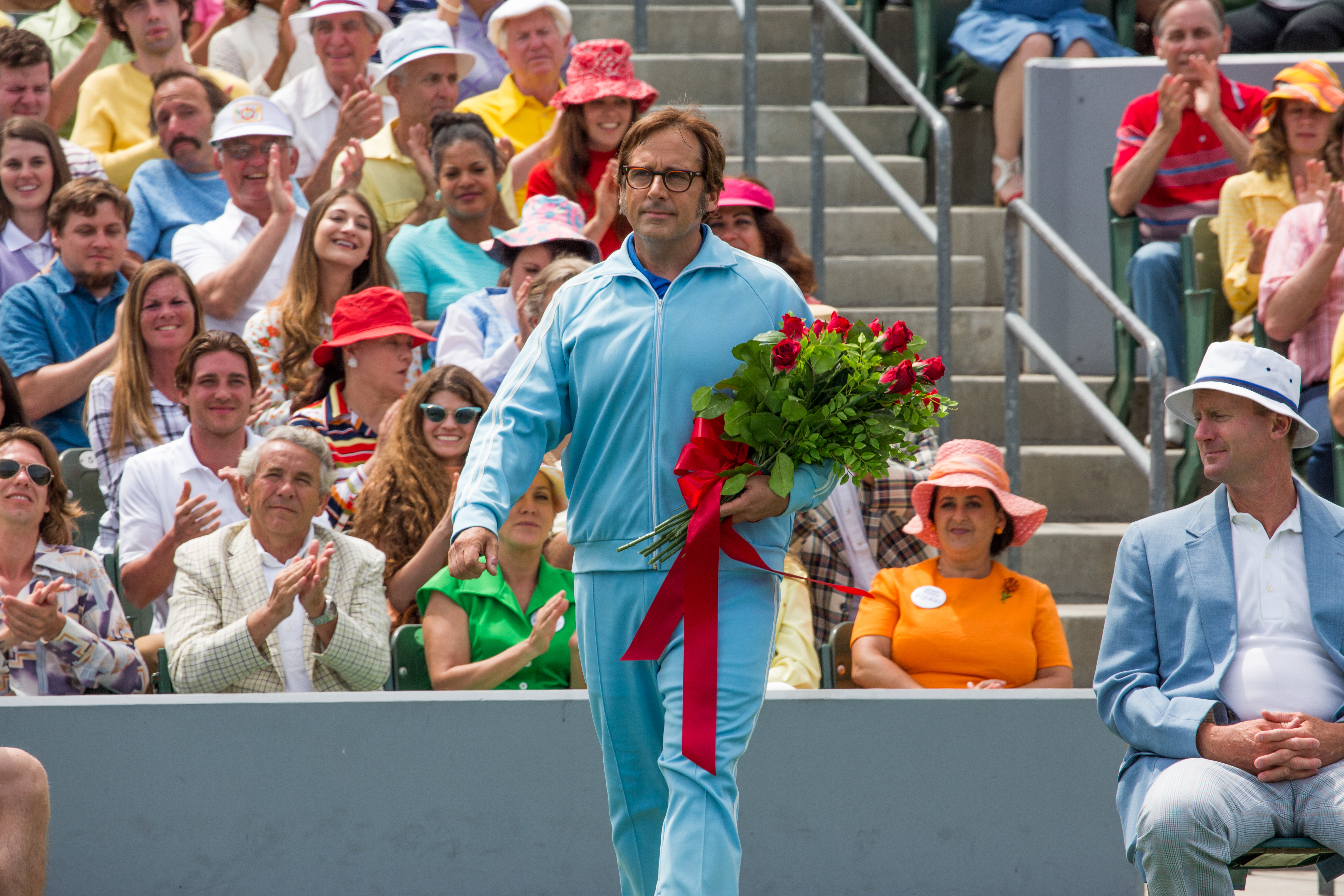 Steve Carell in a blue tracksuit holding roses HD Wallpaper