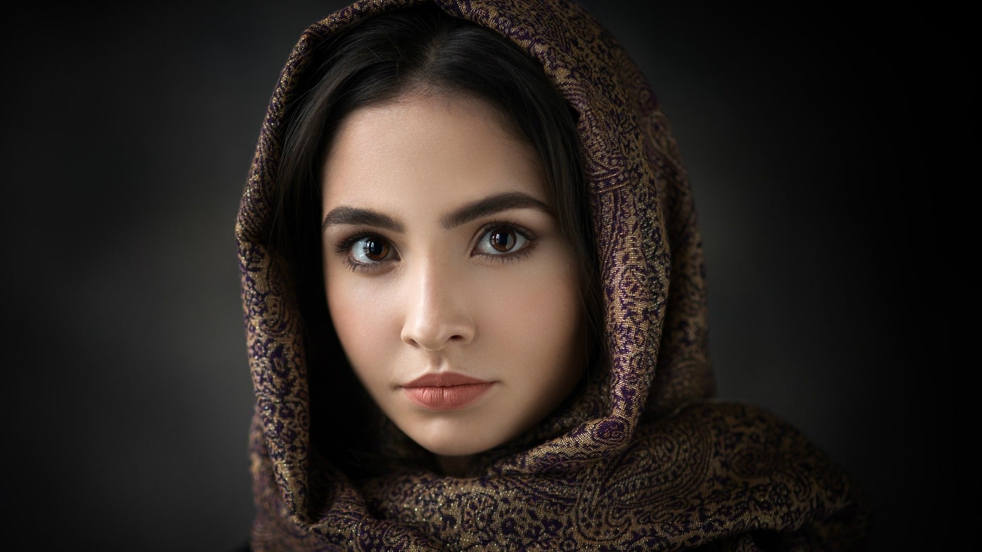 Woman wearing a patterned headscarf HD Wallpaper