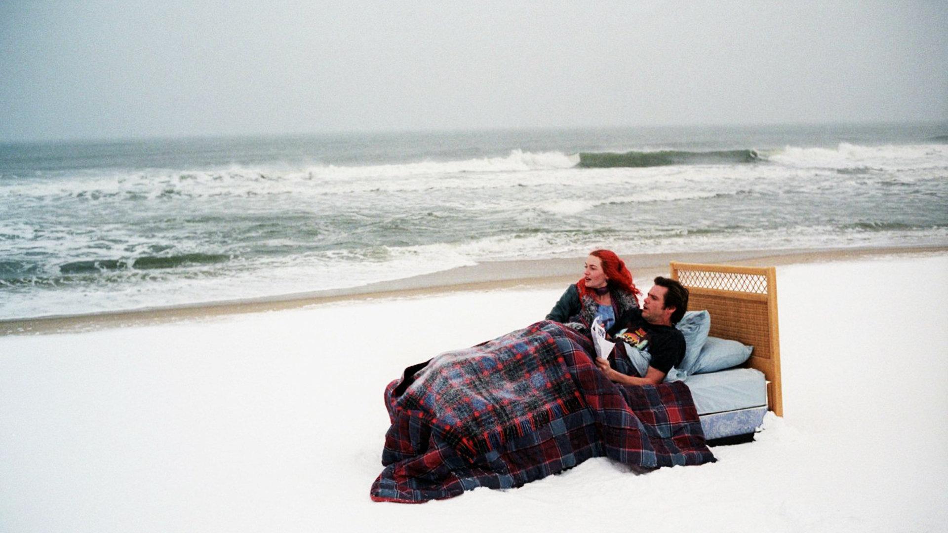 Jim Carrey in bed on a snowy beach HD Wallpaper