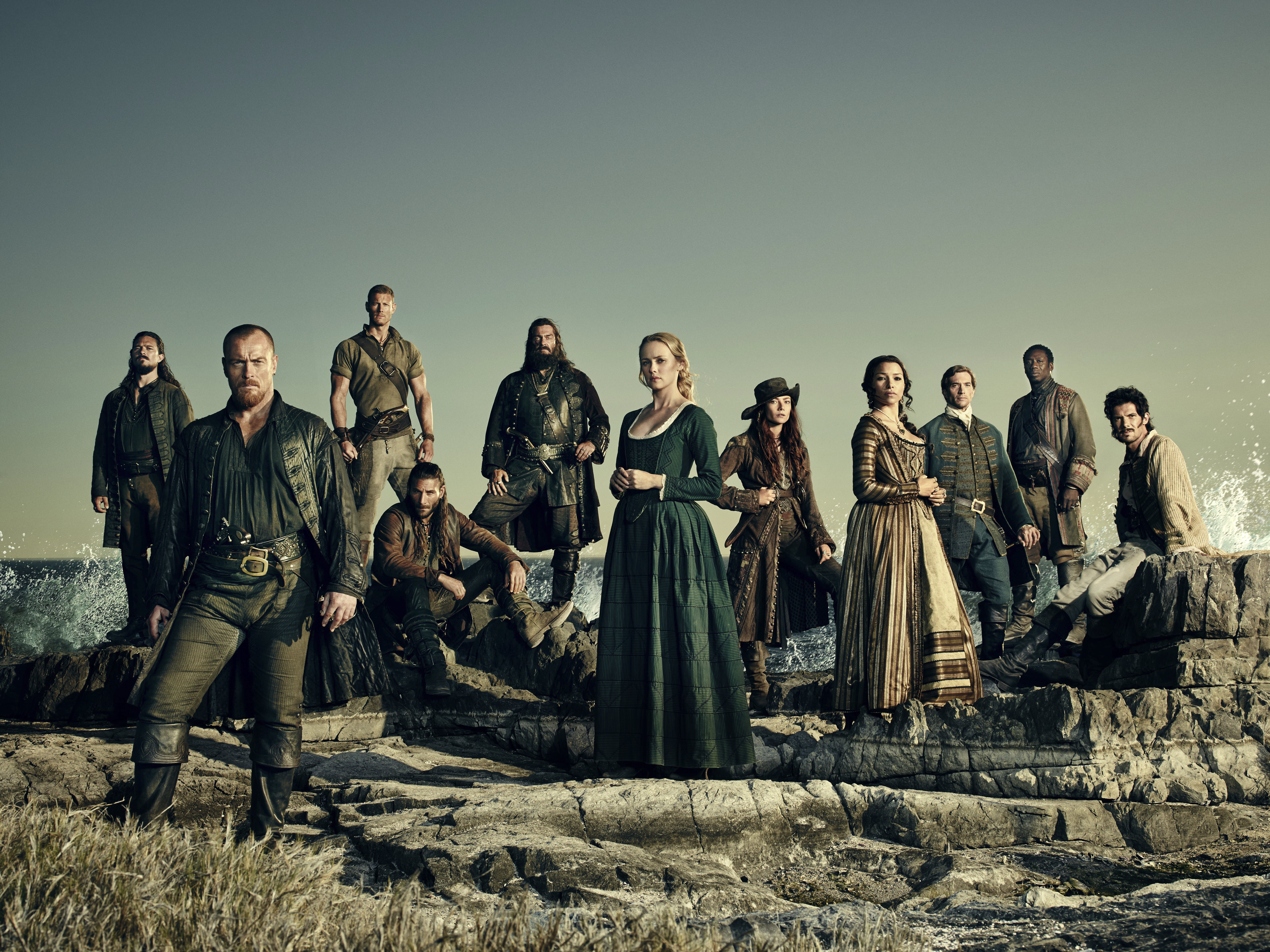 Black Sails cast posing on rocks by the sea HD Wallpaper