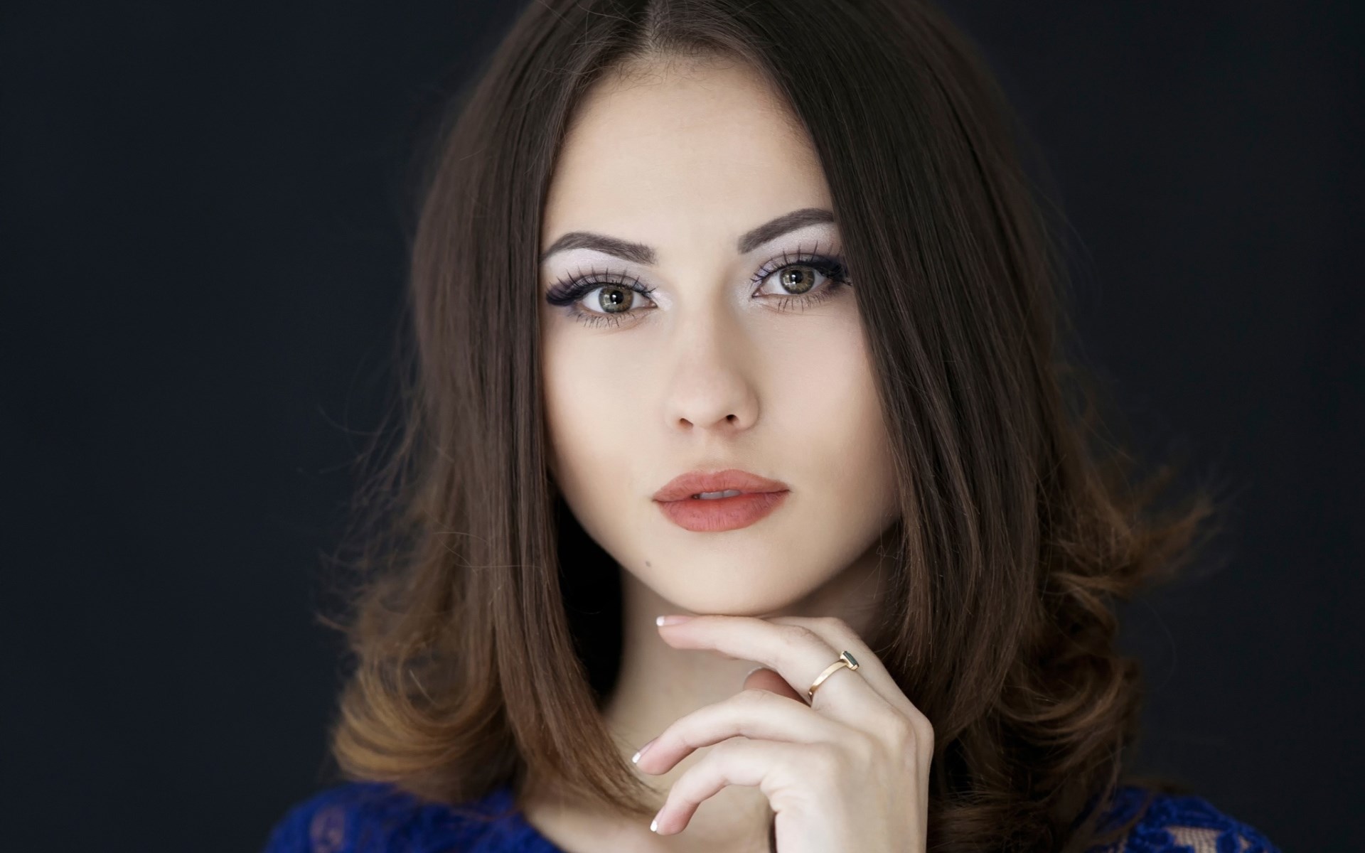 Woman with brown hair and makeup HD Wallpaper