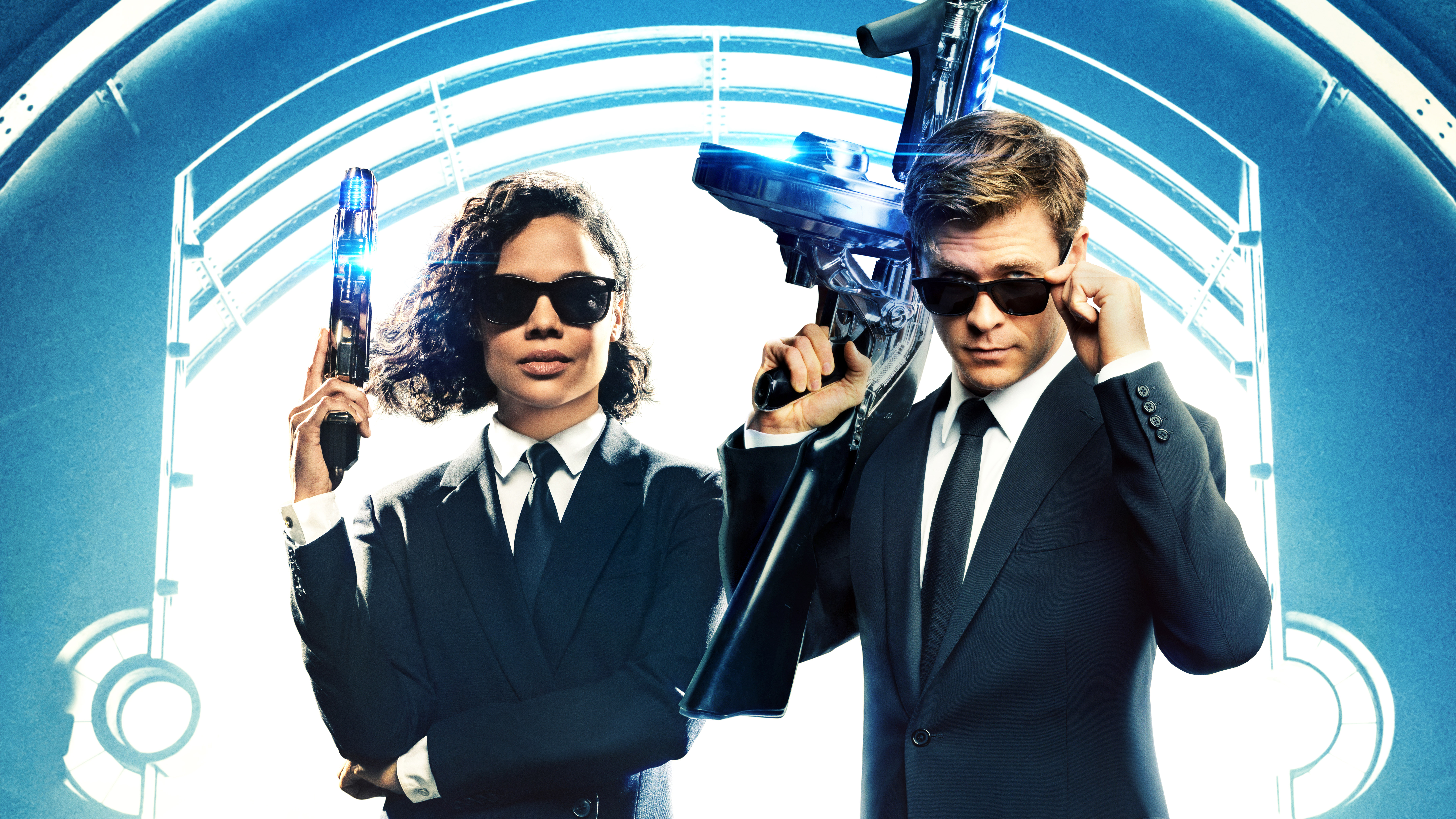 Tessa Thompson and Chris Hemsworth in Men in Black HD Wallpaper