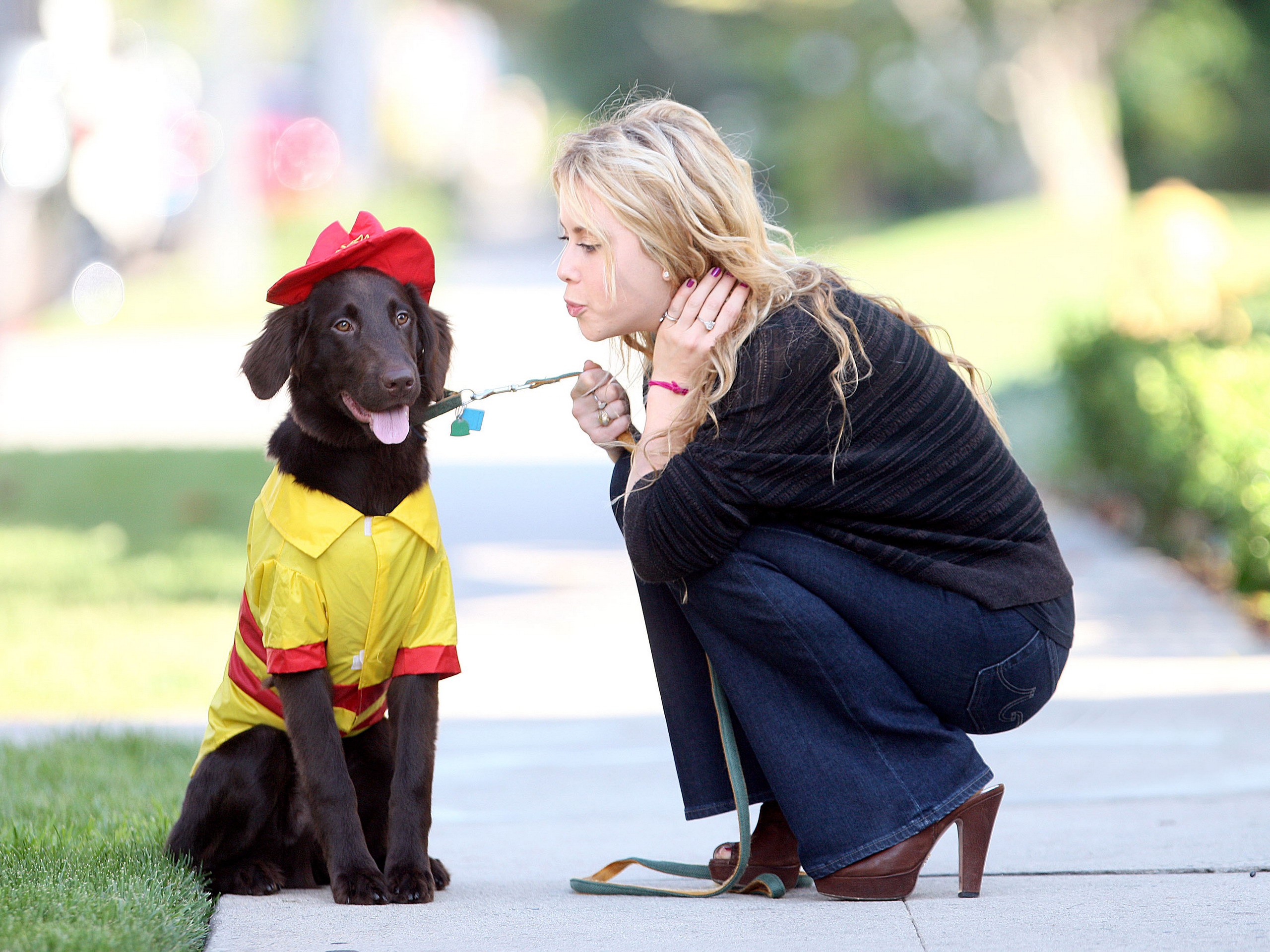 Kate Upton with a dog dressed as a firefighter HD Wallpaper