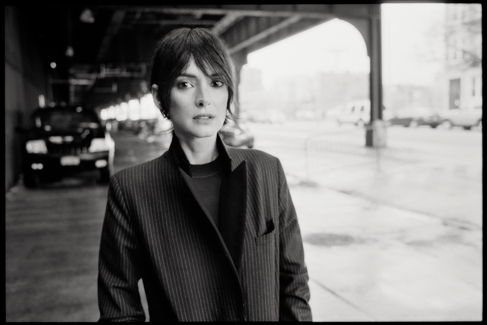 Winona Ryder in a pinstripe suit HD Wallpaper
