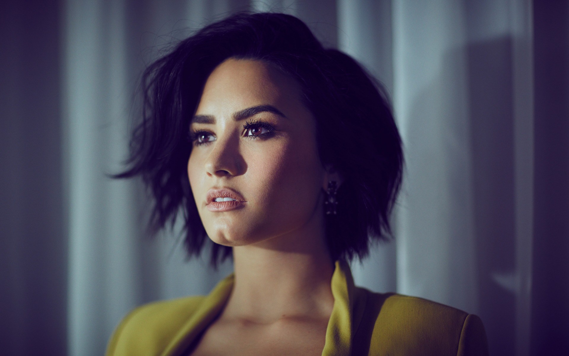 Demi Lovato in a yellow jacket HD Wallpaper