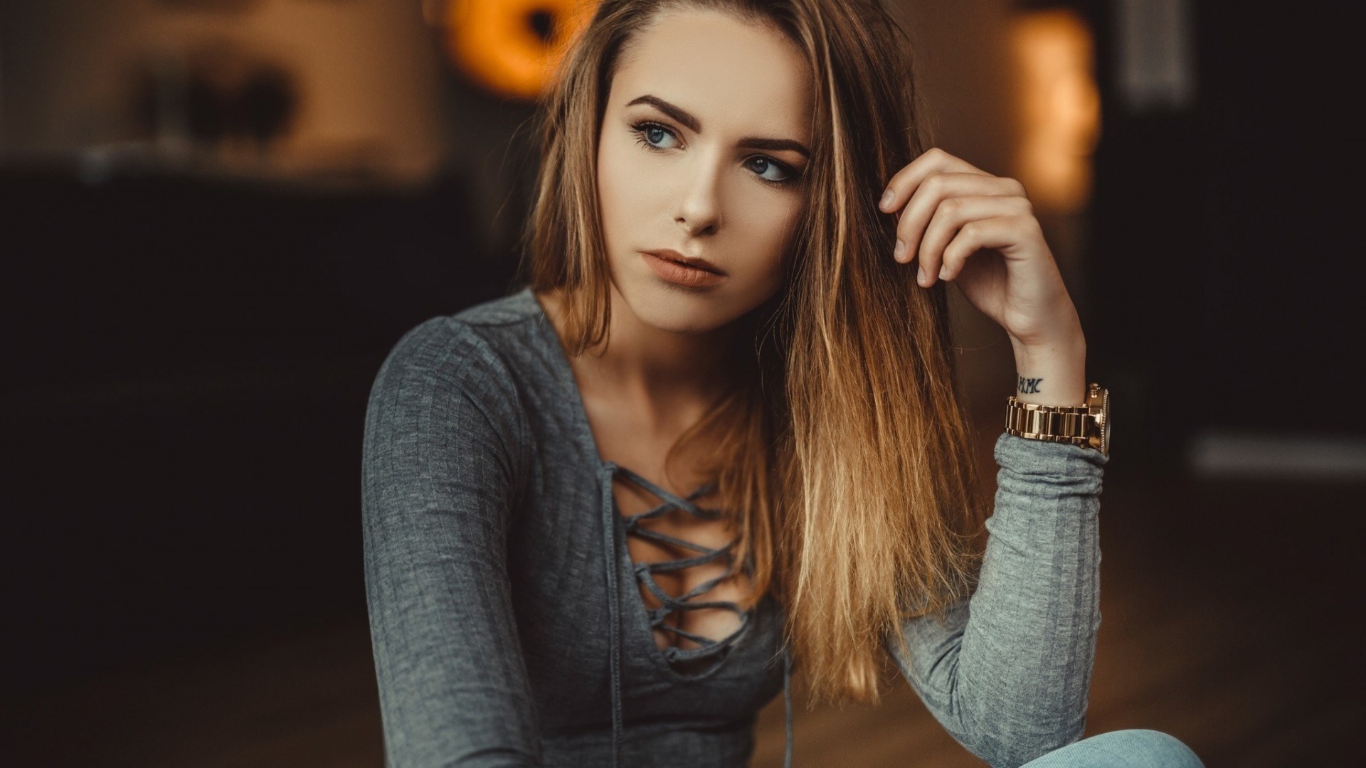 Woman with hand on head and watch HD Wallpaper