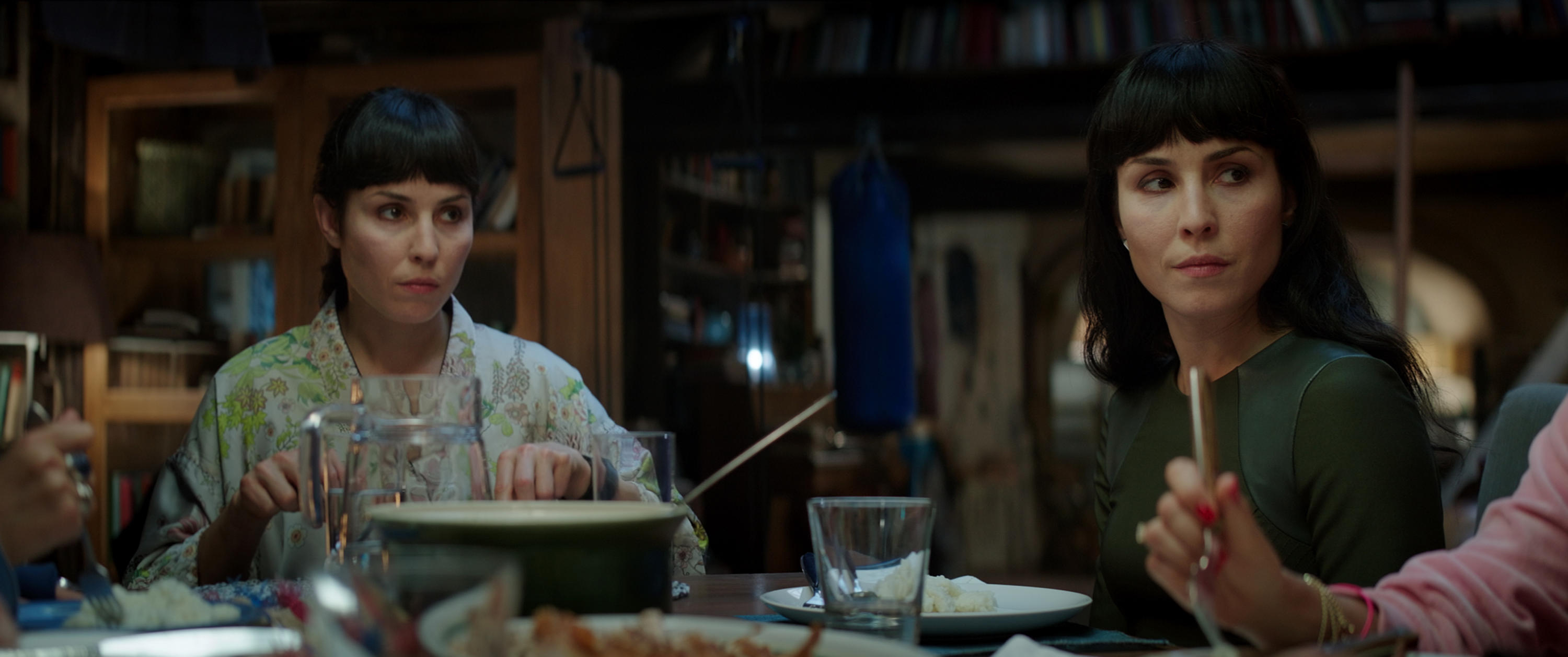 Noomi Rapace at a dinner table HD Wallpaper