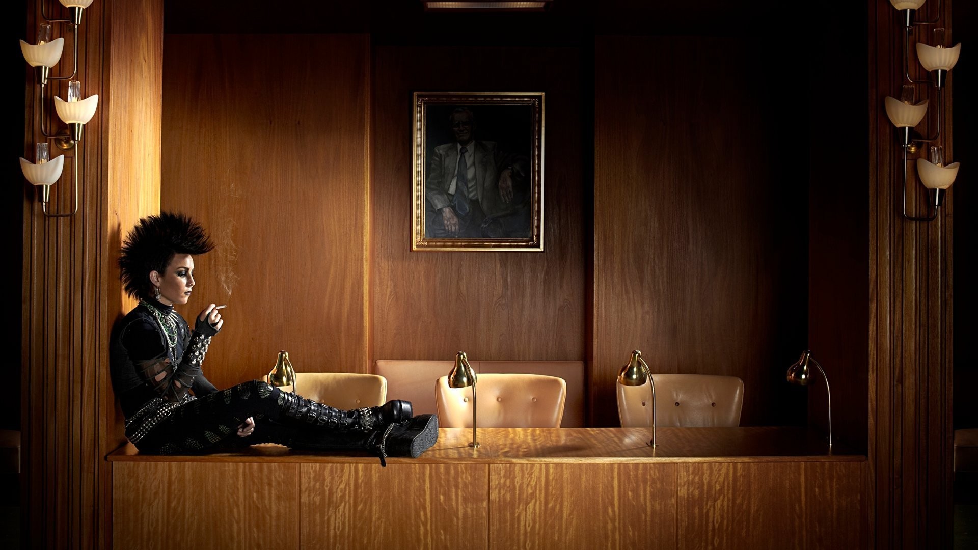 Noomi Rapace smoking in a wood-paneled room HD Wallpaper
