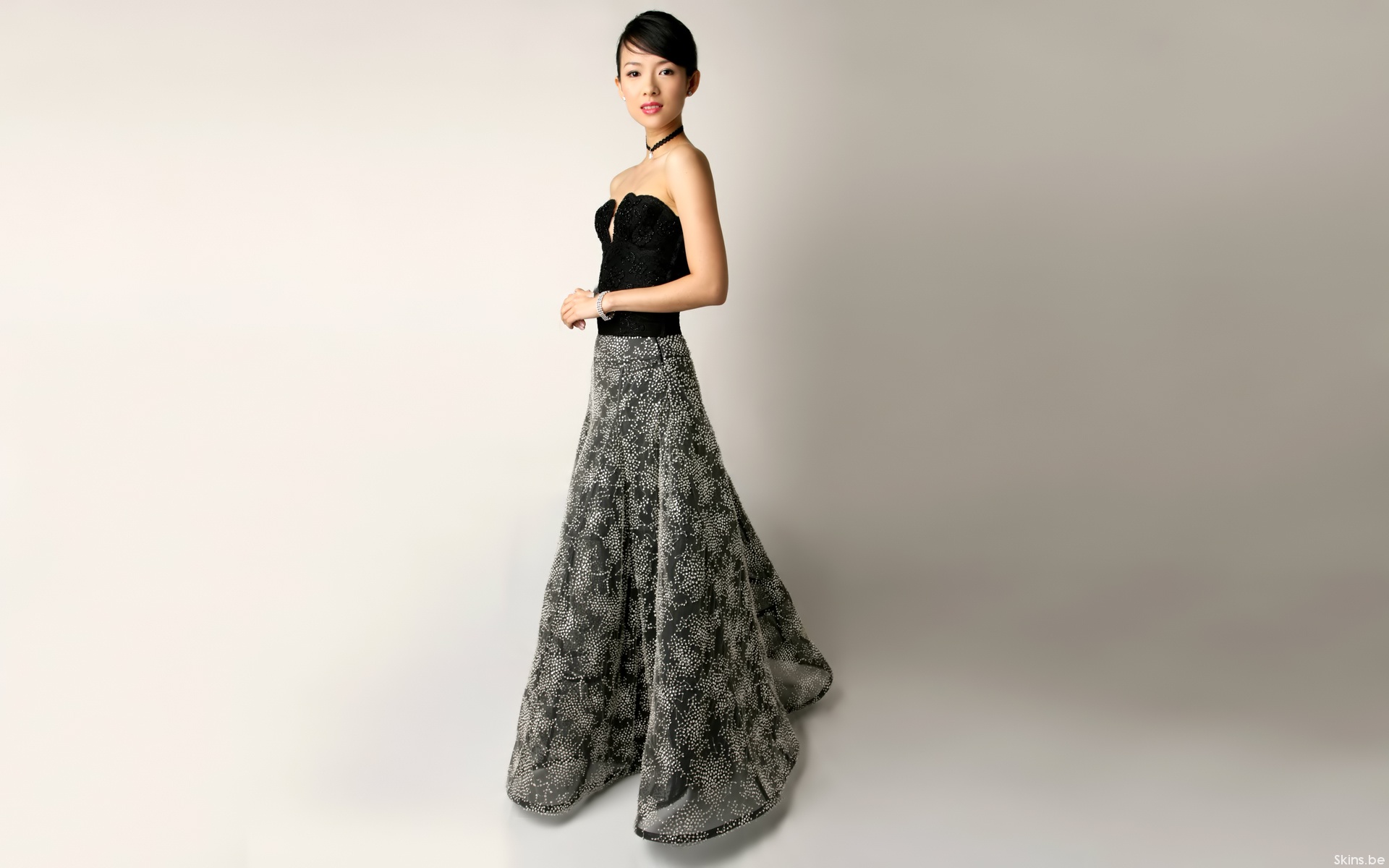 Zhang Ziyi in a black strapless top and patterned skirt HD Wallpaper