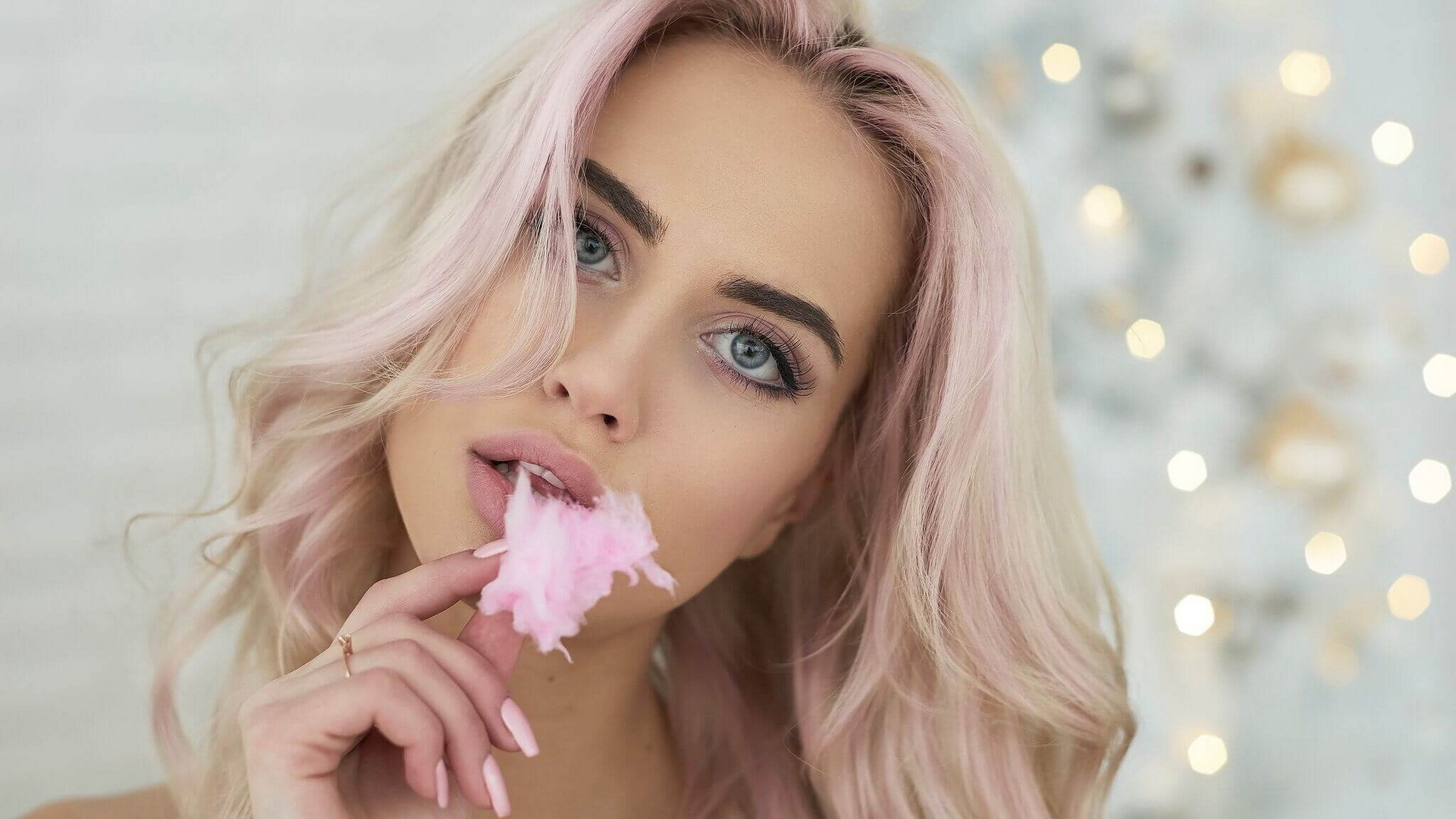 Woman with pink hair eating cotton candy HD Wallpaper