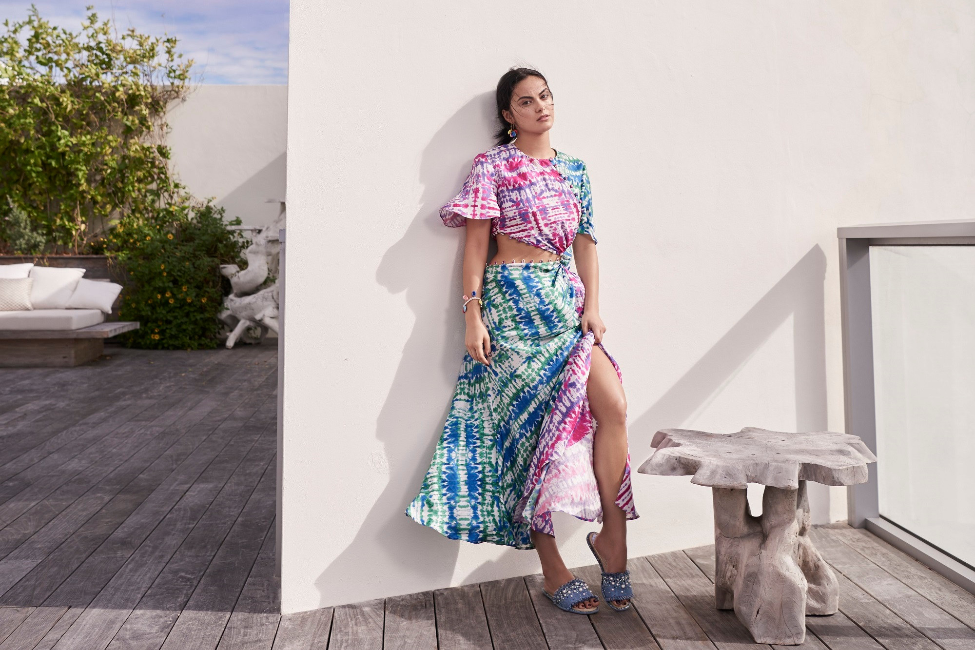 Camila Mendes in a tie-dye outfit on a patio HD Wallpaper