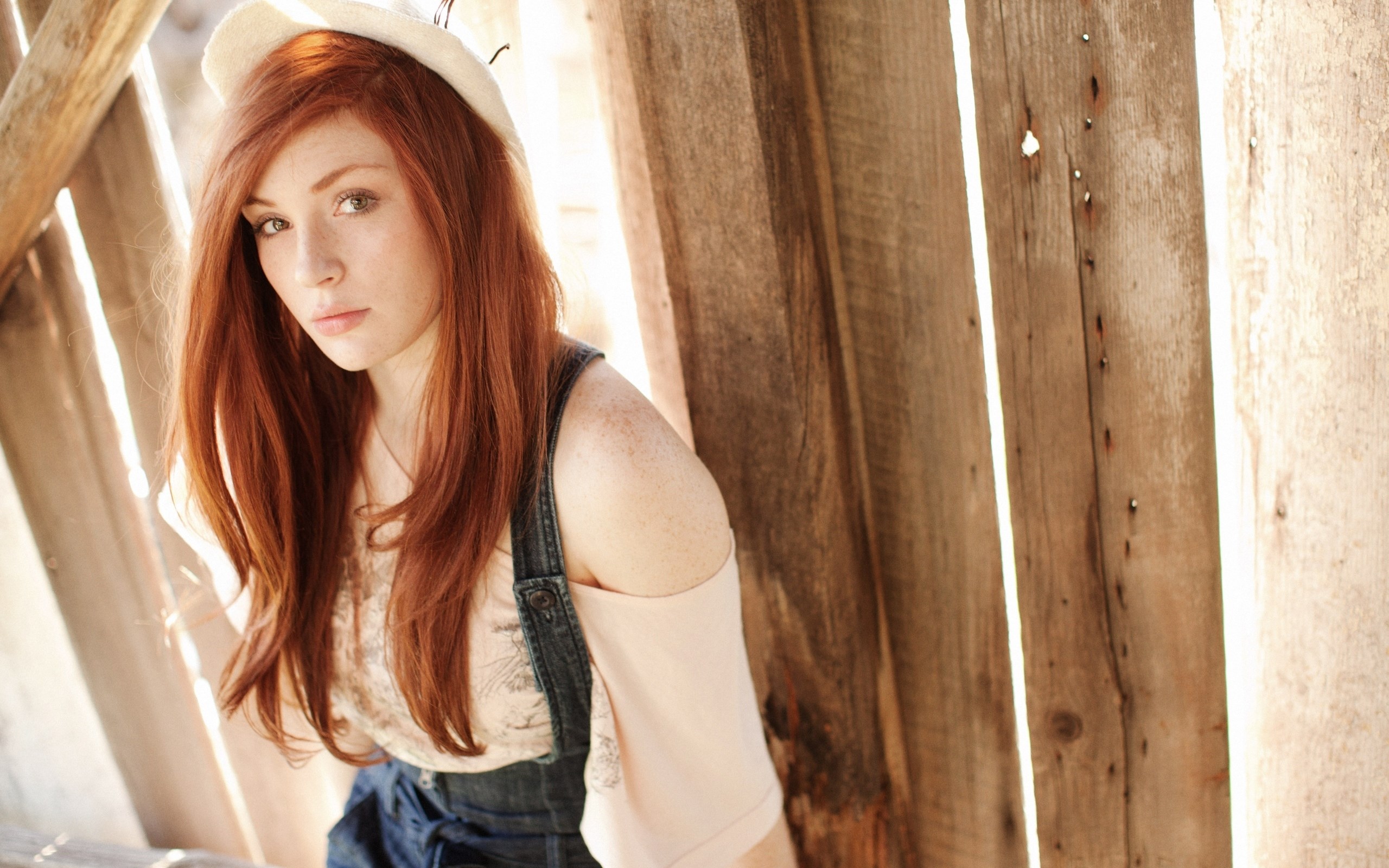 Red-haired woman wearing a hat and overalls HD Wallpaper