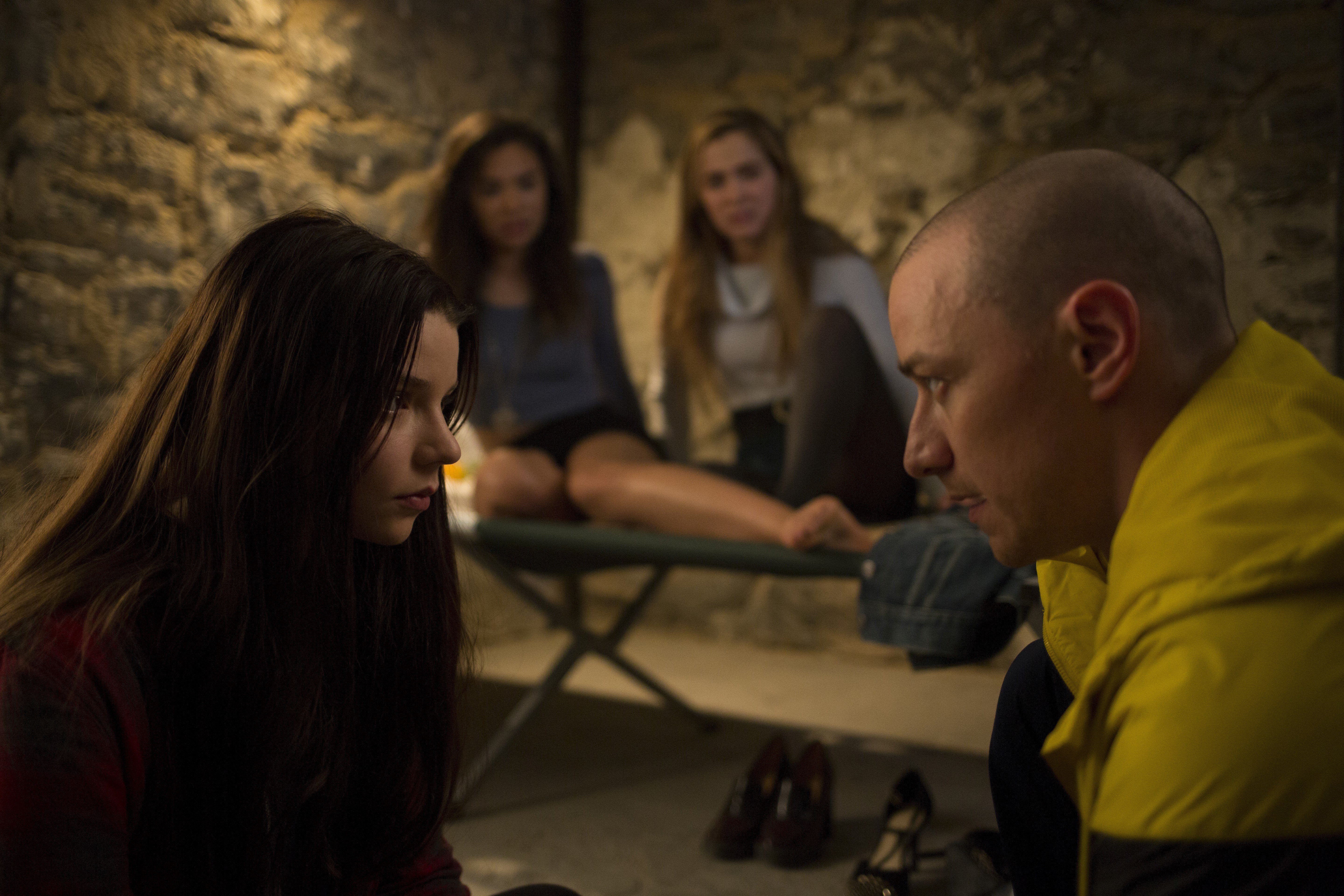 James McAvoy with three women in a basement HD Wallpaper