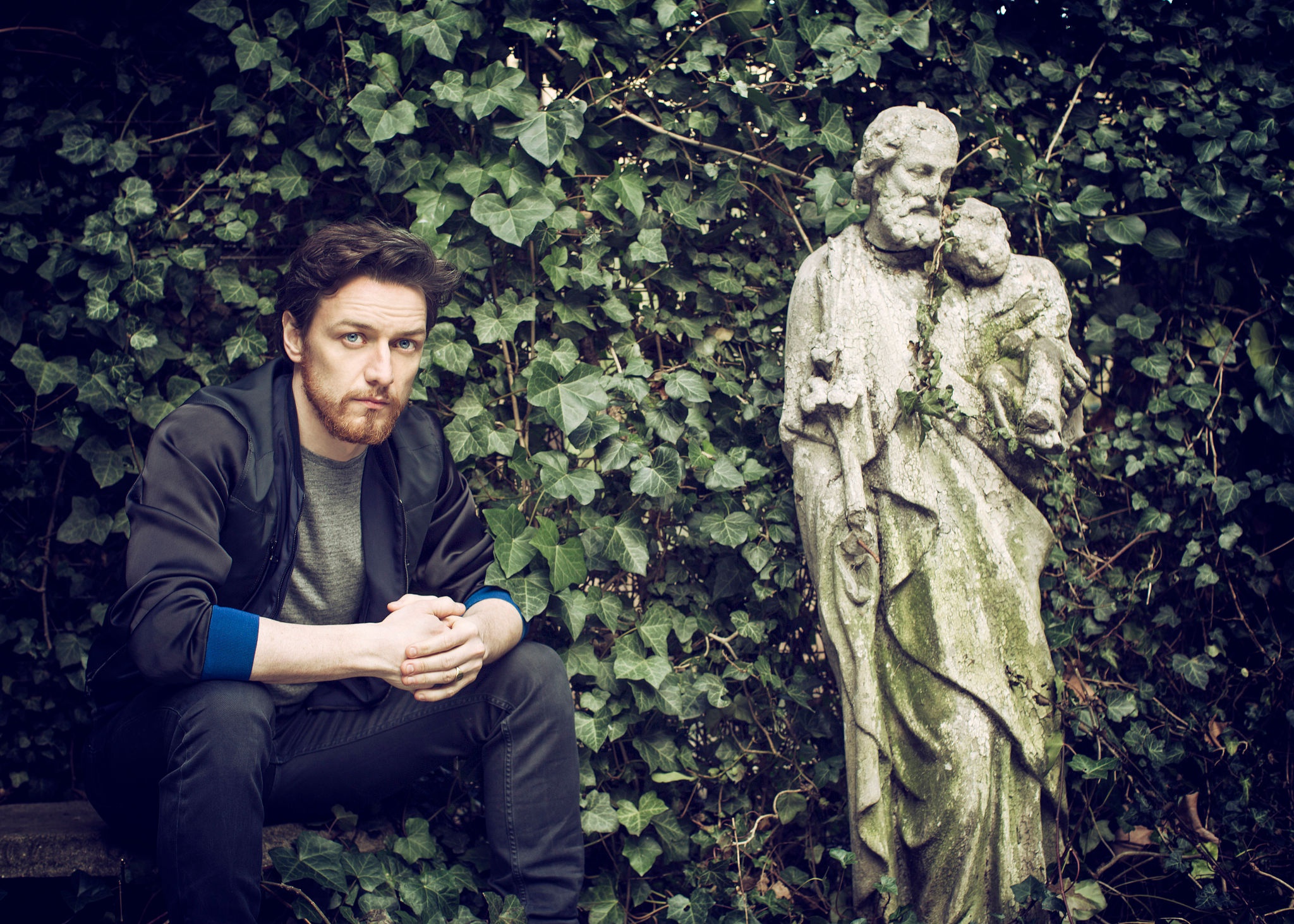 James McAvoy sitting near a statue HD Wallpaper