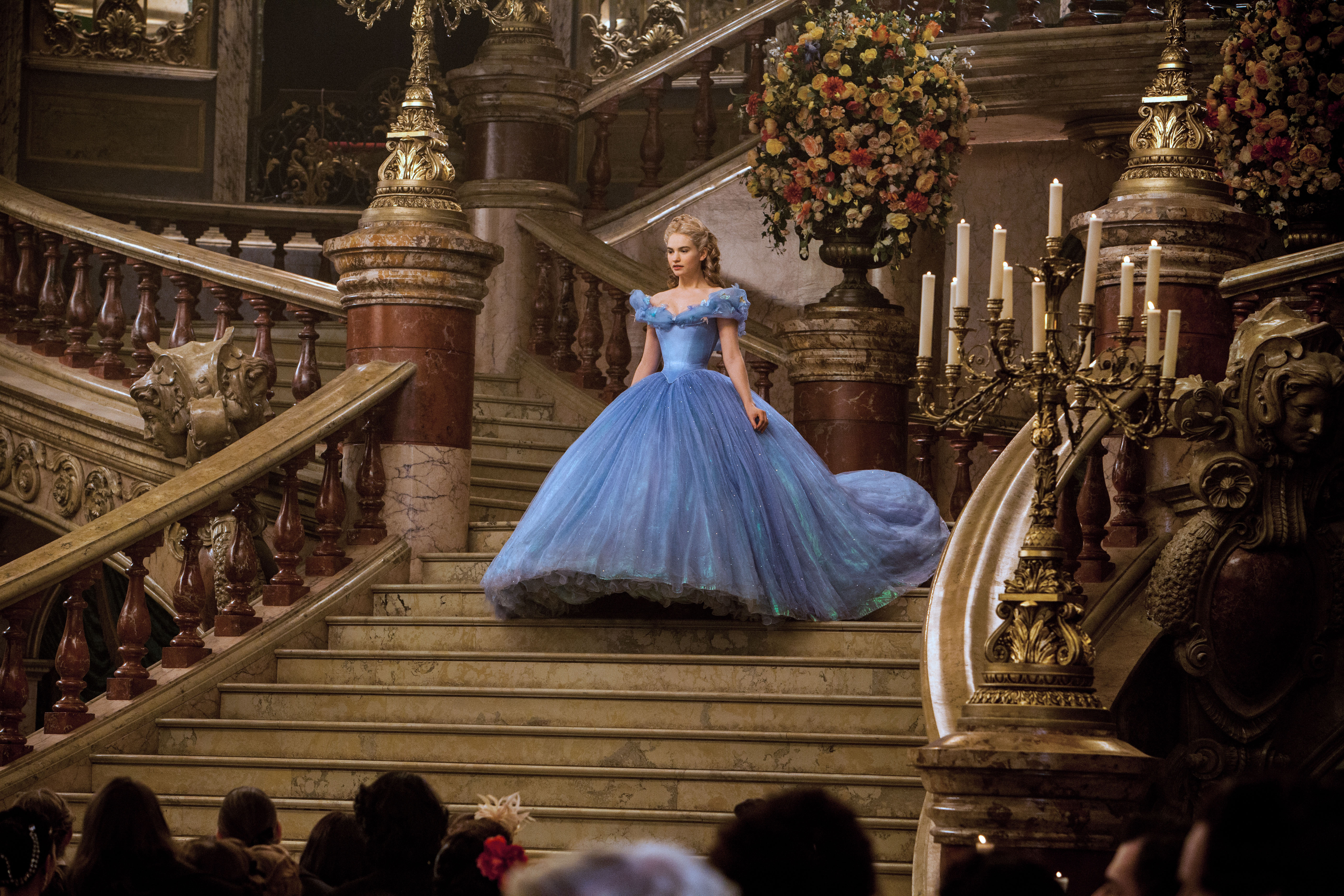 Lily James as Cinderella on a grand staircase HD Wallpaper