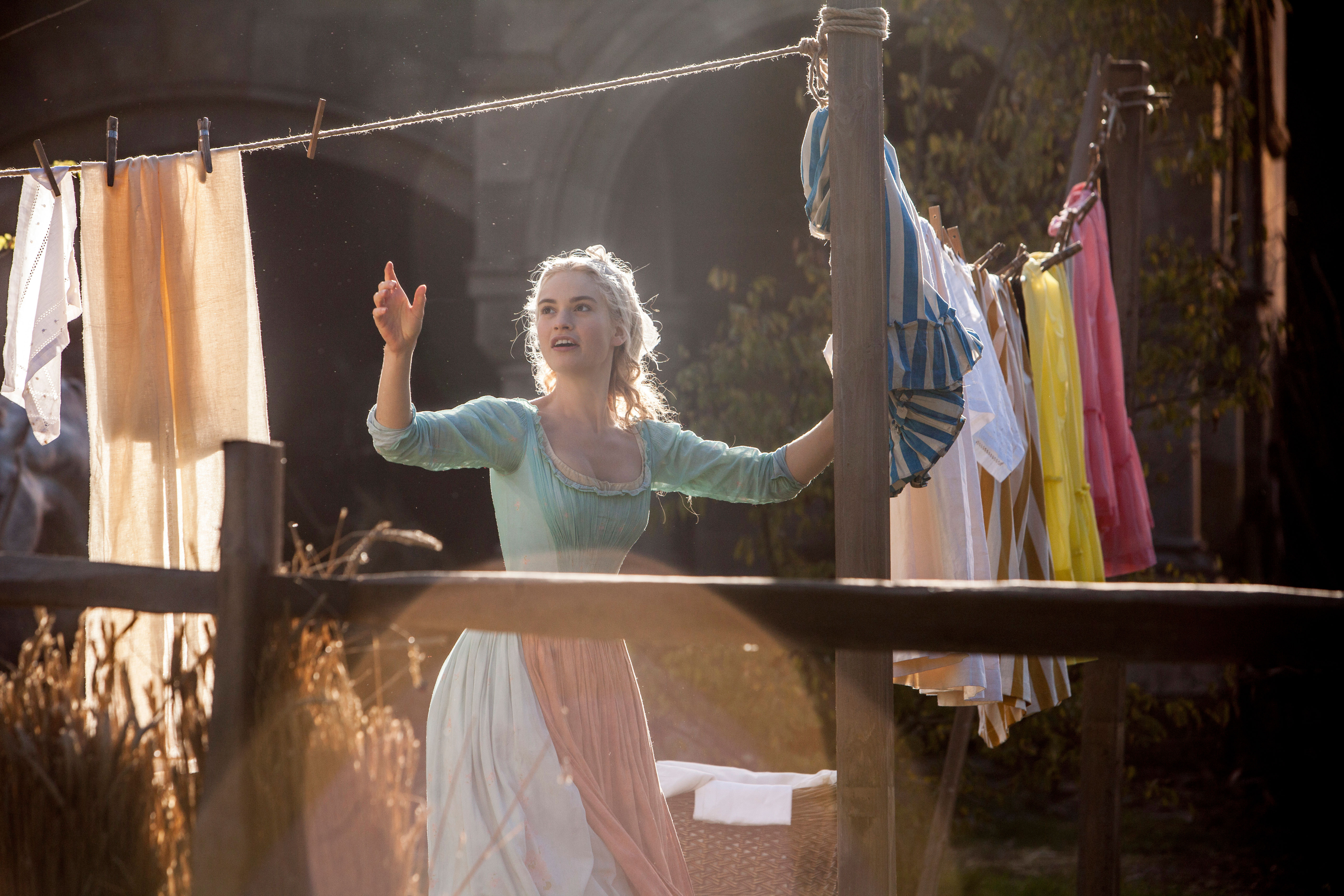 Lily James hanging laundry HD Wallpaper