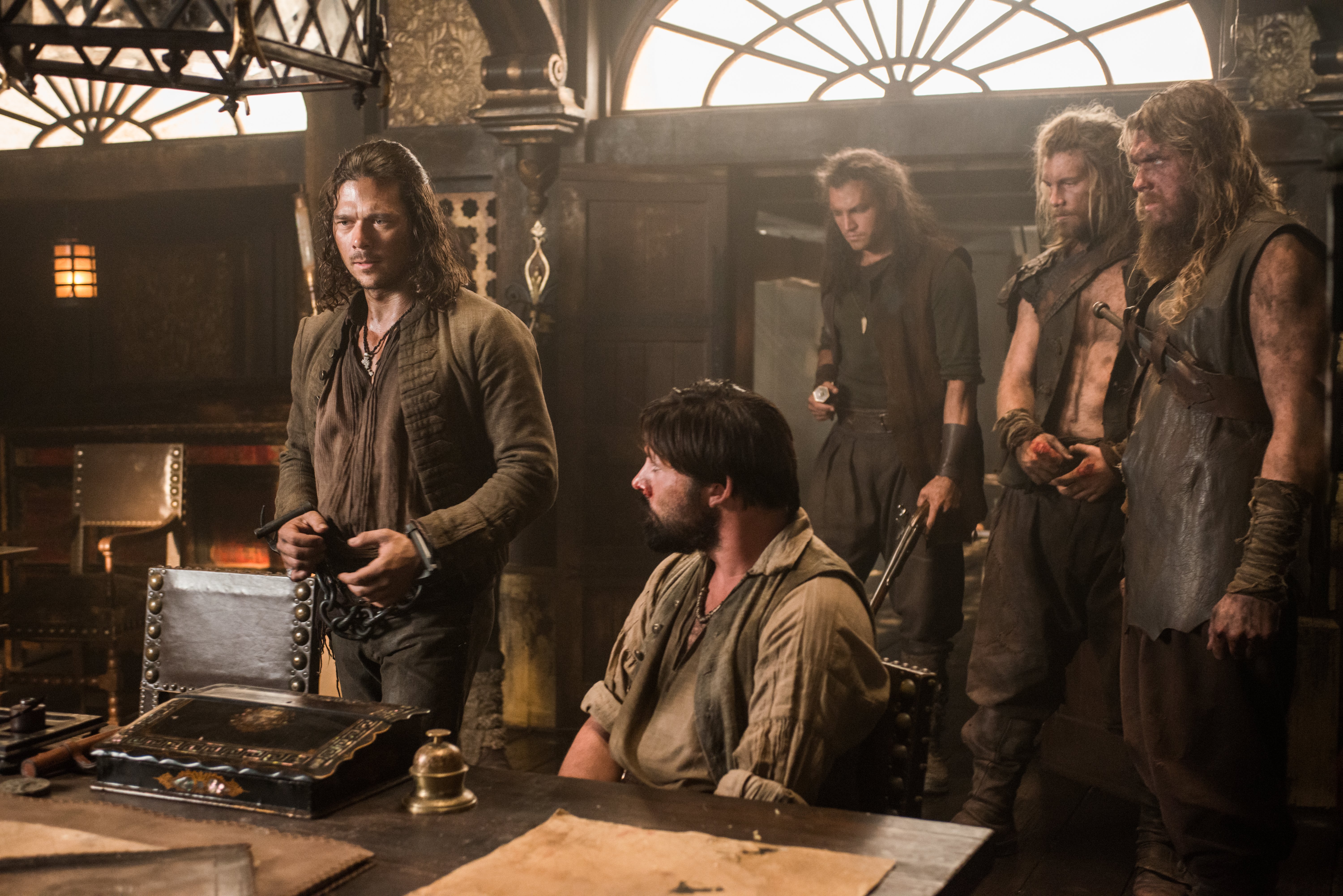 Luke Arnold and men in a room HD Wallpaper