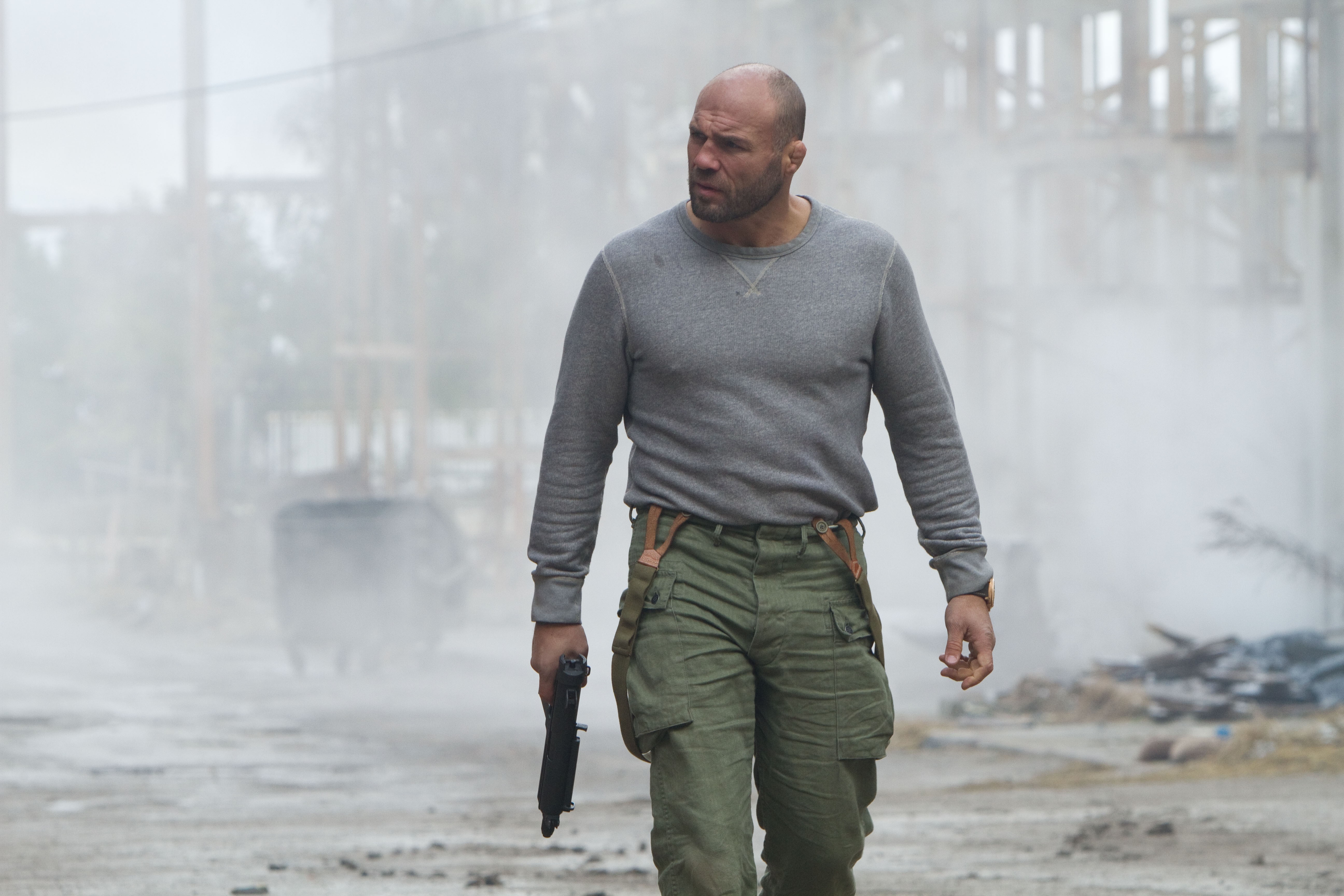 Randy Couture holding a gun HD Wallpaper