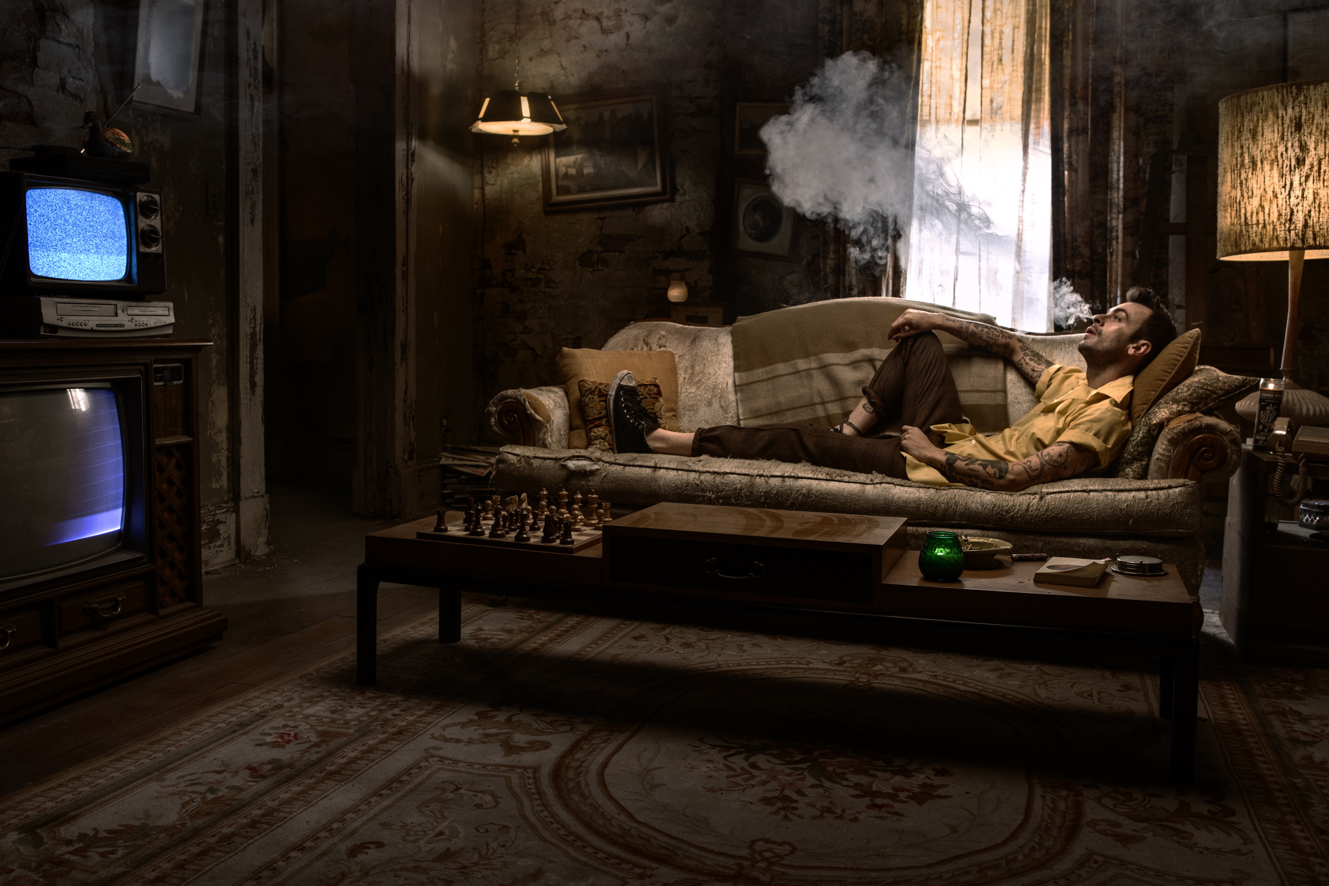 Joseph Gilgun smoking on a couch HD Wallpaper